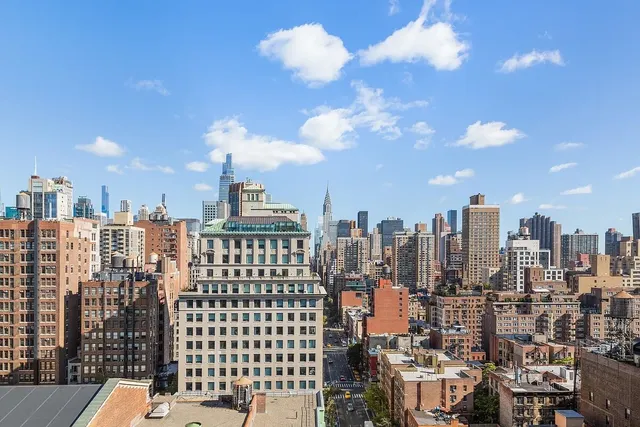 a view of a city with tall buildings