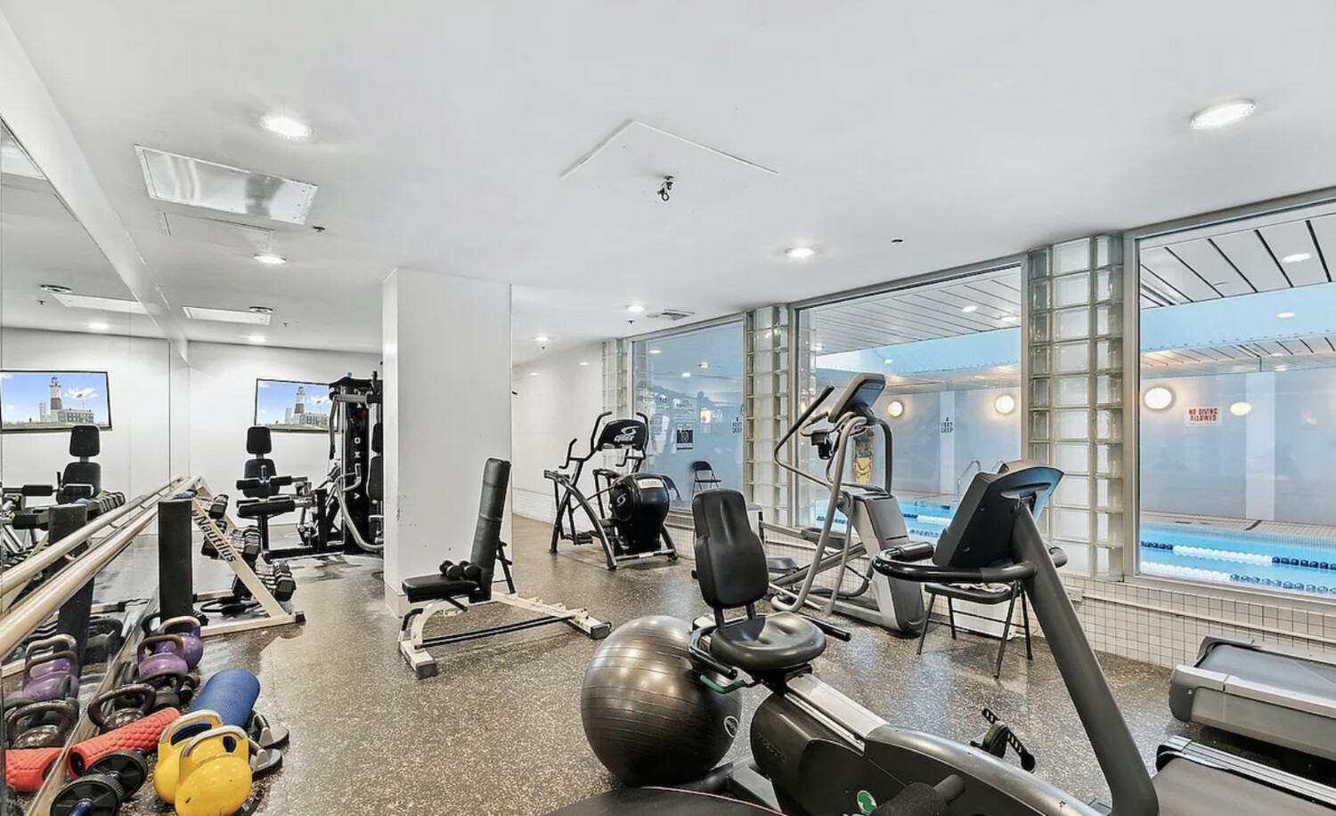 50 Lexington Avenue, Unit 22C Manhattan, NY 10010 - Photo 11 of 14 a view of a room with gym equipment