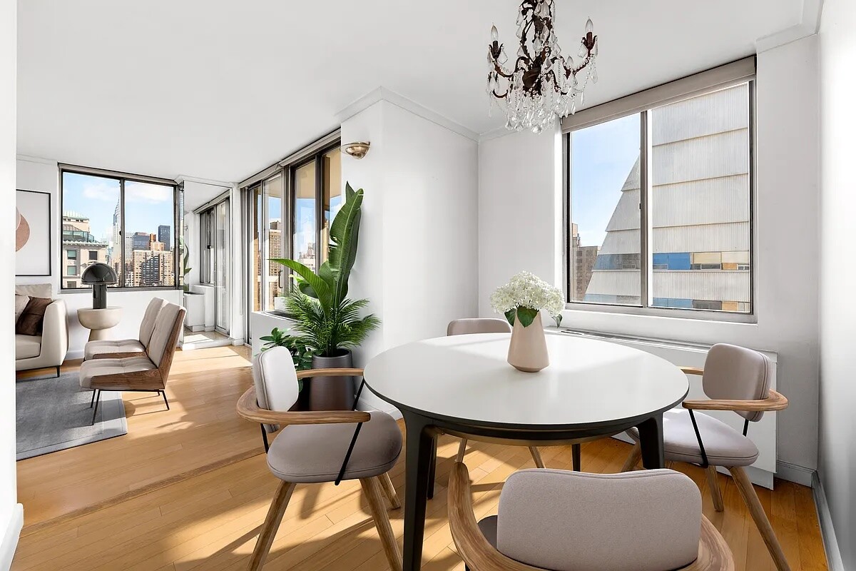50 Lexington Avenue, Unit 22C Manhattan, NY 10010 - Photo 4 of 14 a living room with furniture and a window