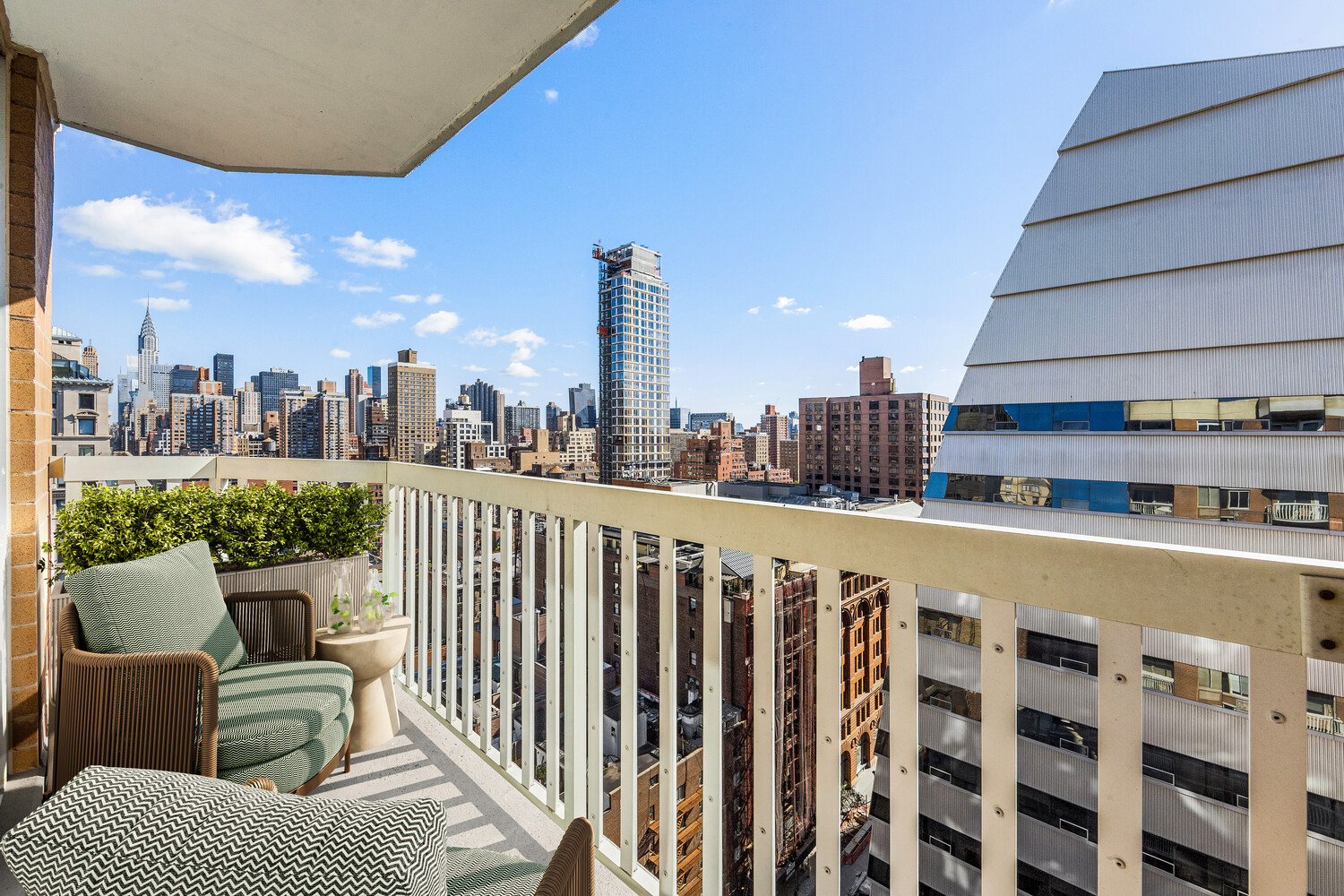 50 Lexington Avenue, Unit 22C Manhattan, NY 10010 - Photo 6 of 14 a view of a chairs and table in the terrace