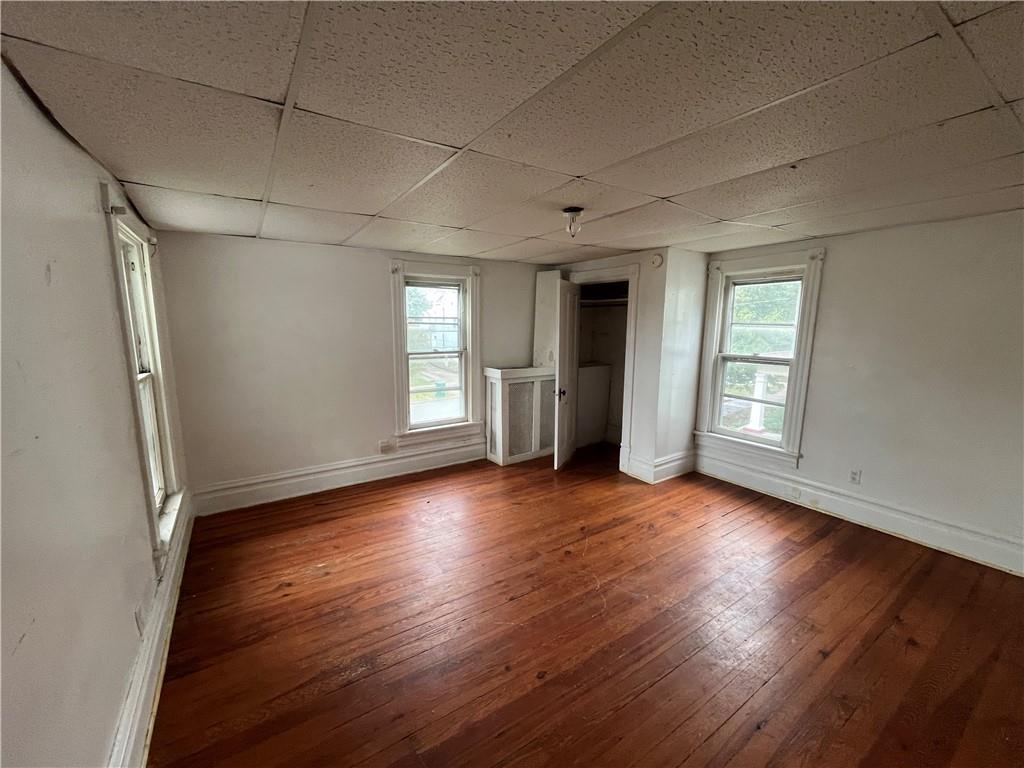 475 South 7th Street Indiana, PA 15701 - Photo 17 of 24 an empty room with wooden floor and windows
