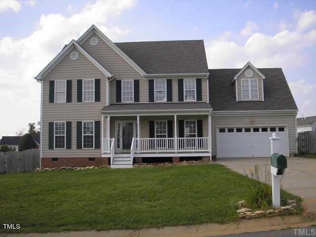 112 Grassy Valley Road Holly Springs, NC 27540 - Photo 1 of 39 front view of a house with a yard