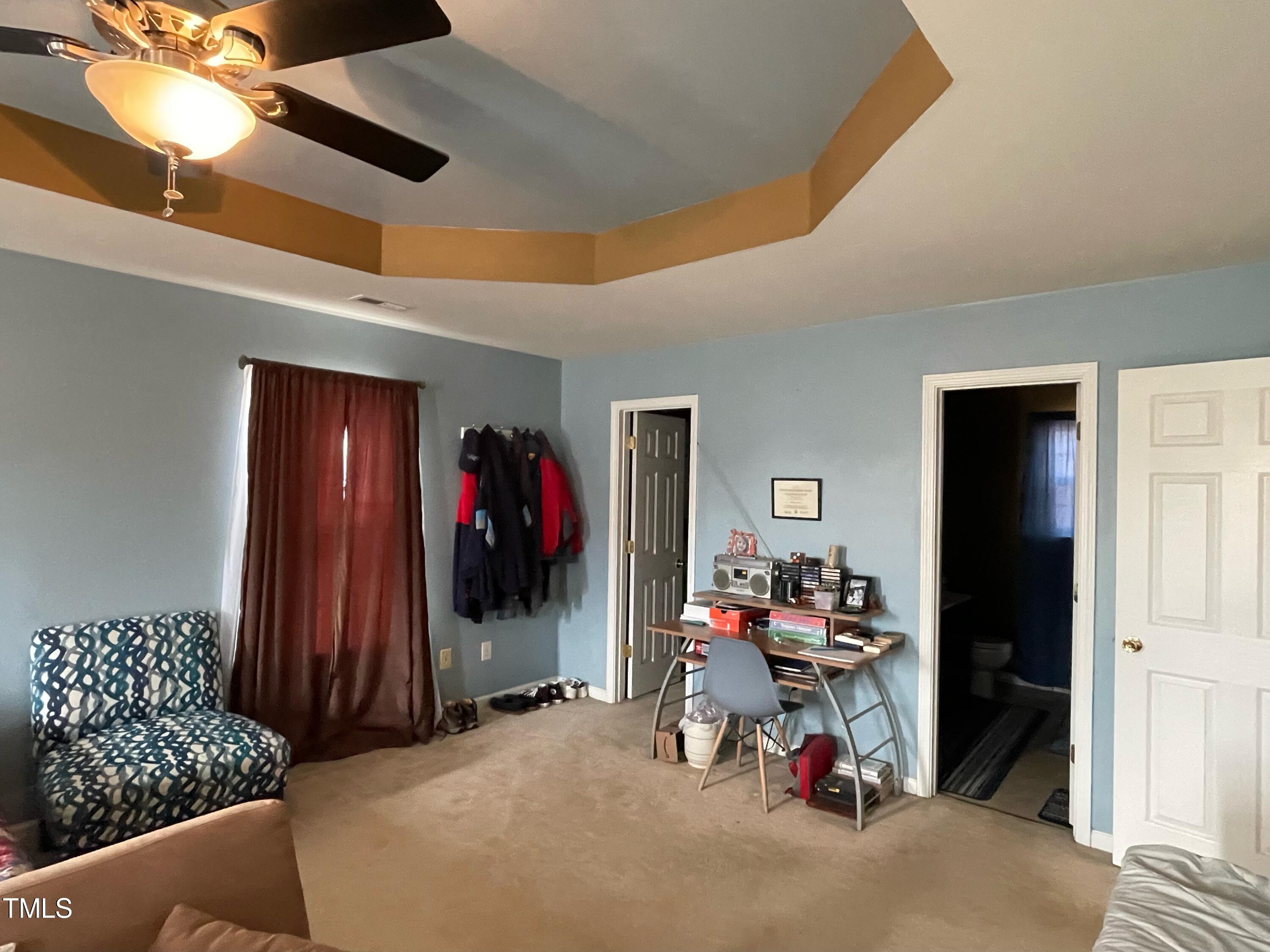 112 Grassy Valley Road Holly Springs, NC 27540 - Photo 22 of 39 a living room with furniture and a window