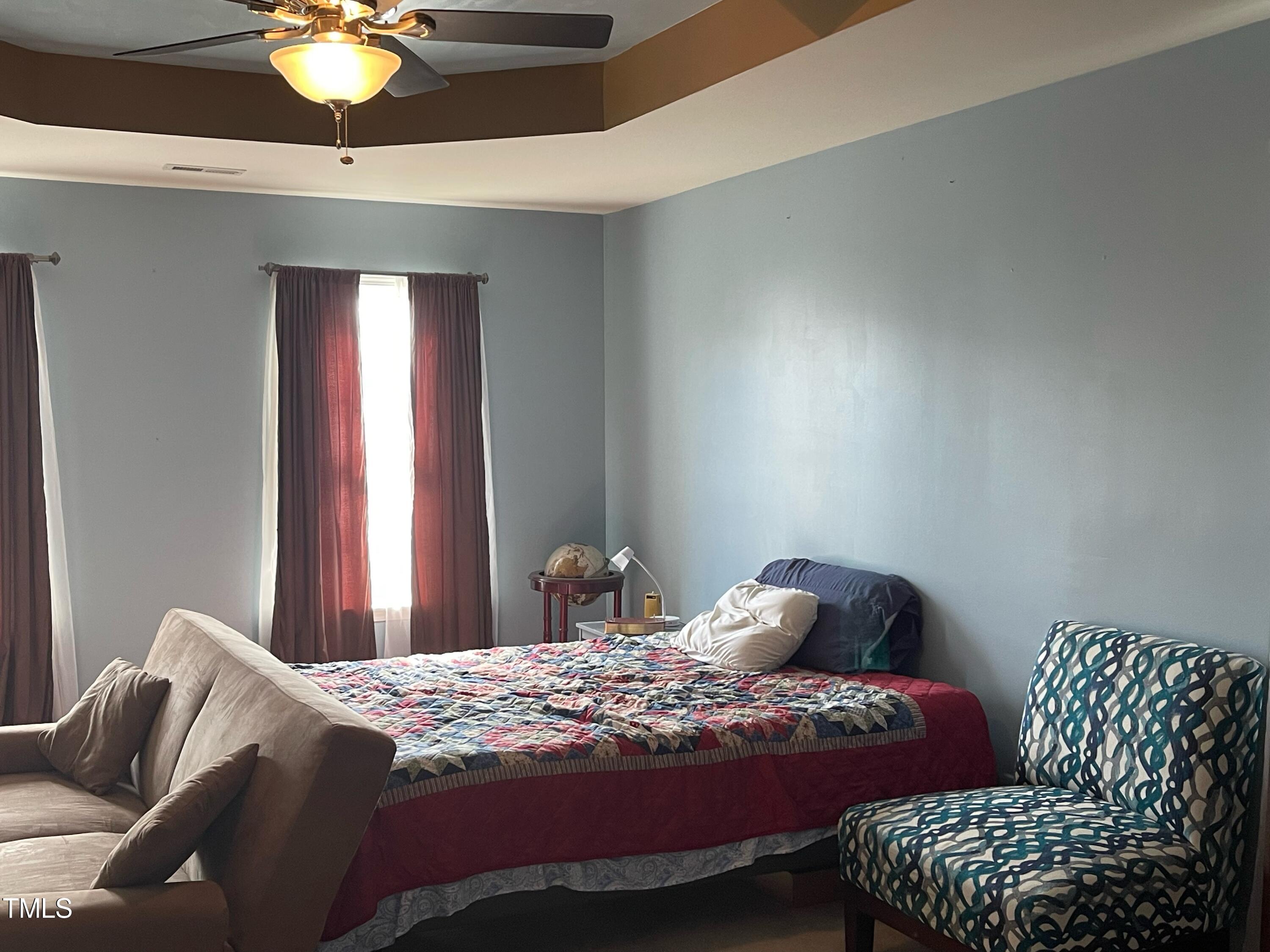 112 Grassy Valley Road Holly Springs, NC 27540 - Photo 23 of 39 a bedroom with a bed and window