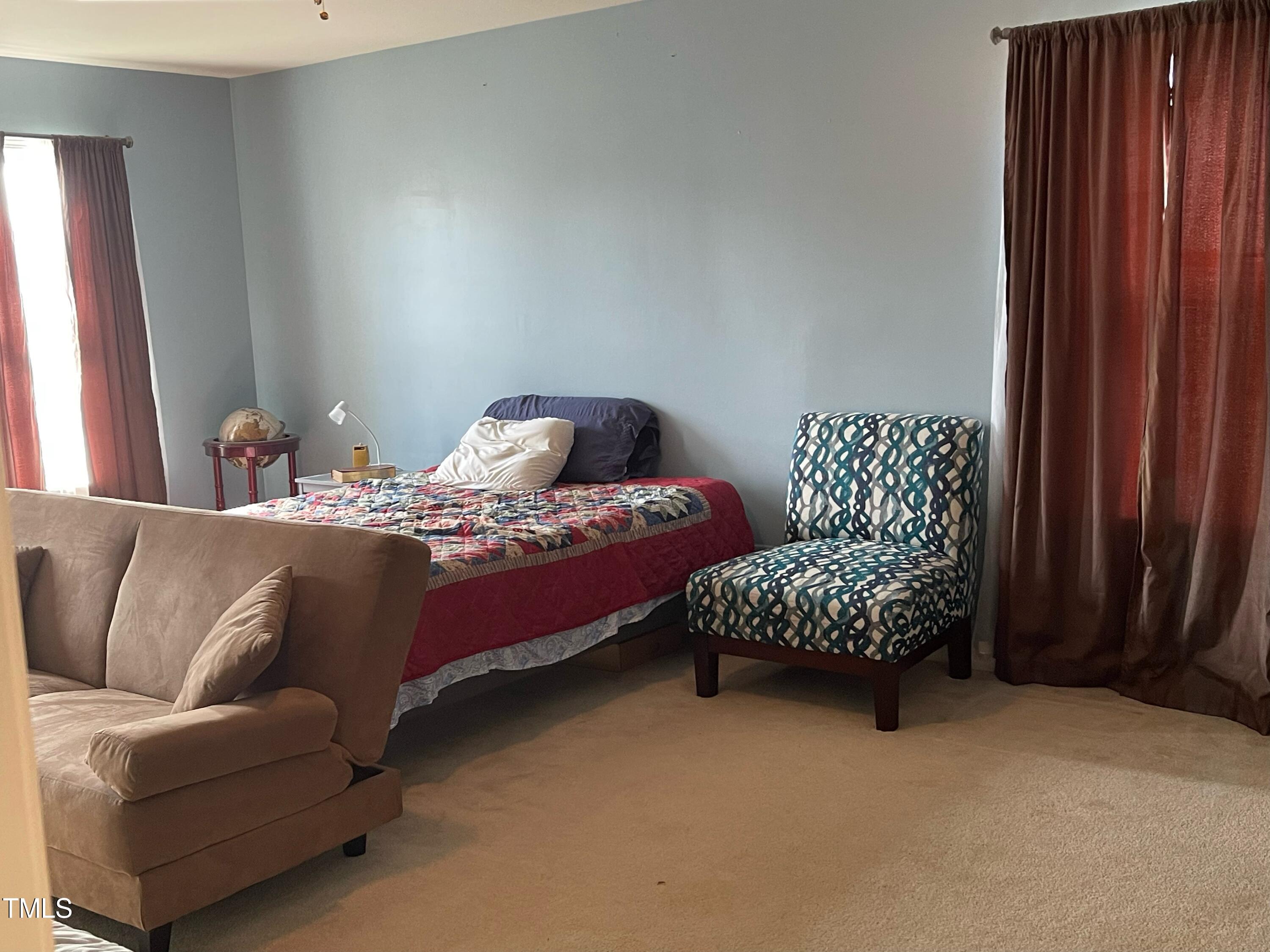 112 Grassy Valley Road Holly Springs, NC 27540 - Photo 25 of 39 a bedroom with furniture and a window