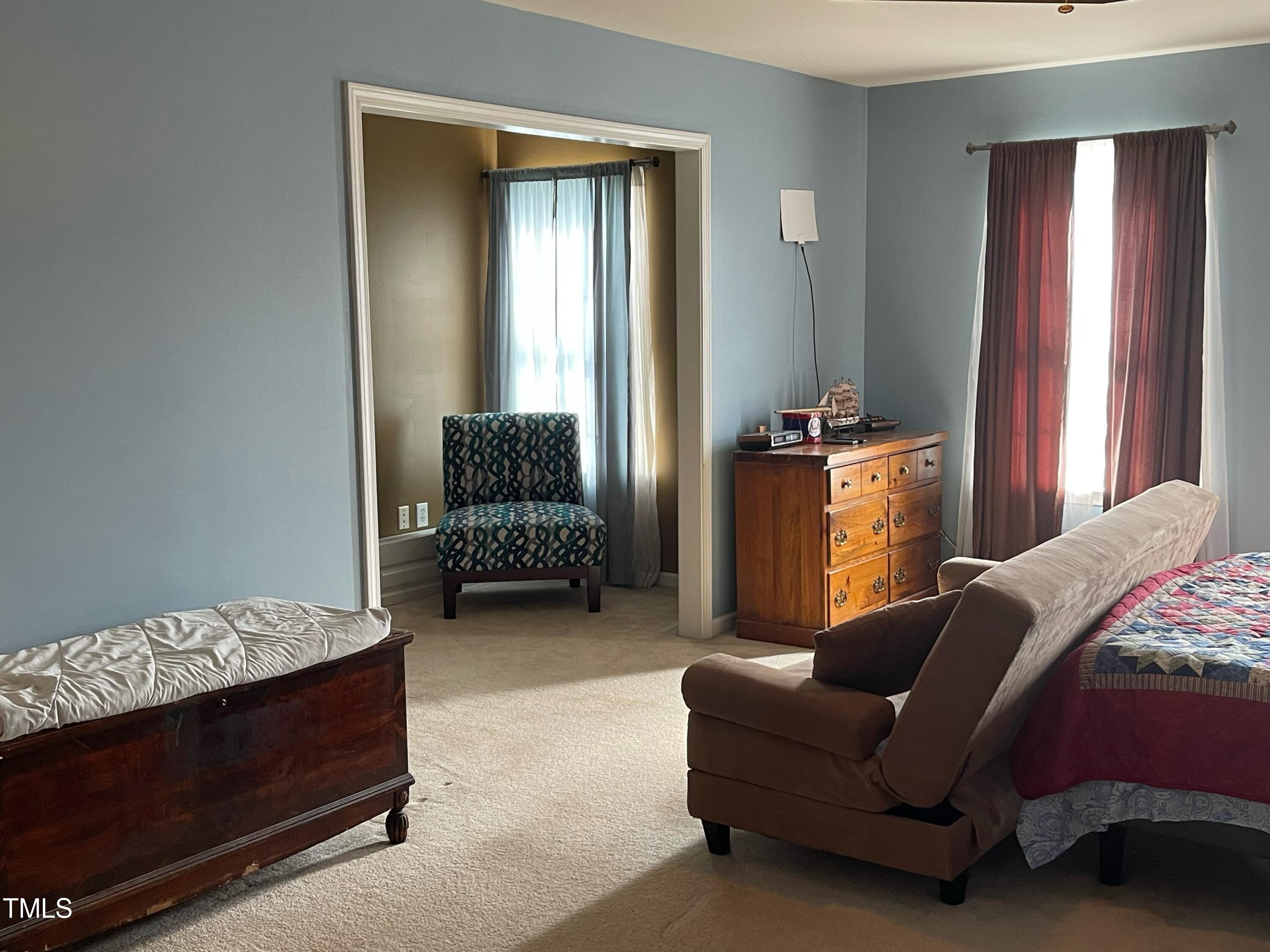 112 Grassy Valley Road Holly Springs, NC 27540 - Photo 26 of 39 a living room with furniture and a window
