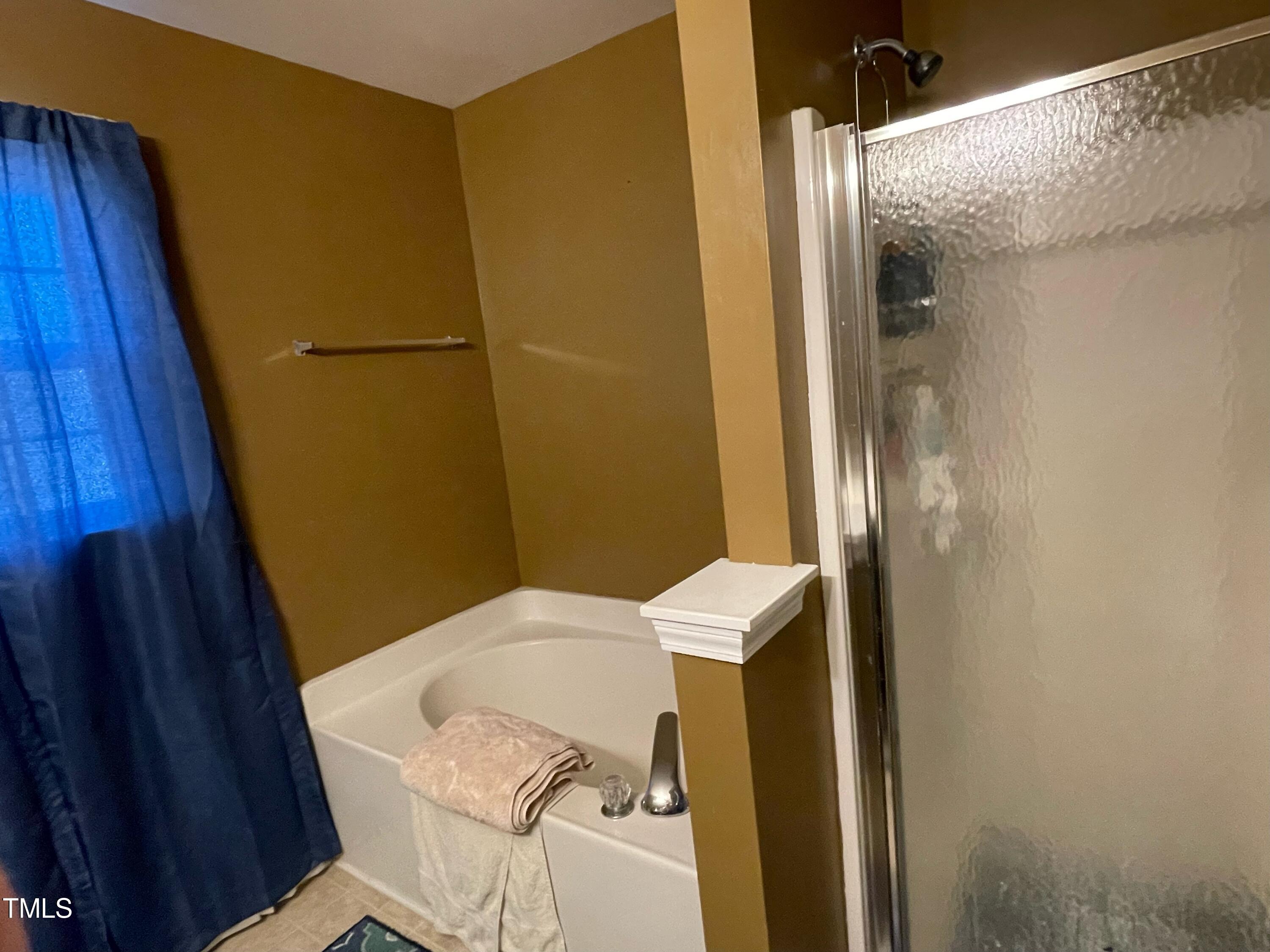 112 Grassy Valley Road Holly Springs, NC 27540 - Photo 31 of 39 a bathroom with a sink and toilet