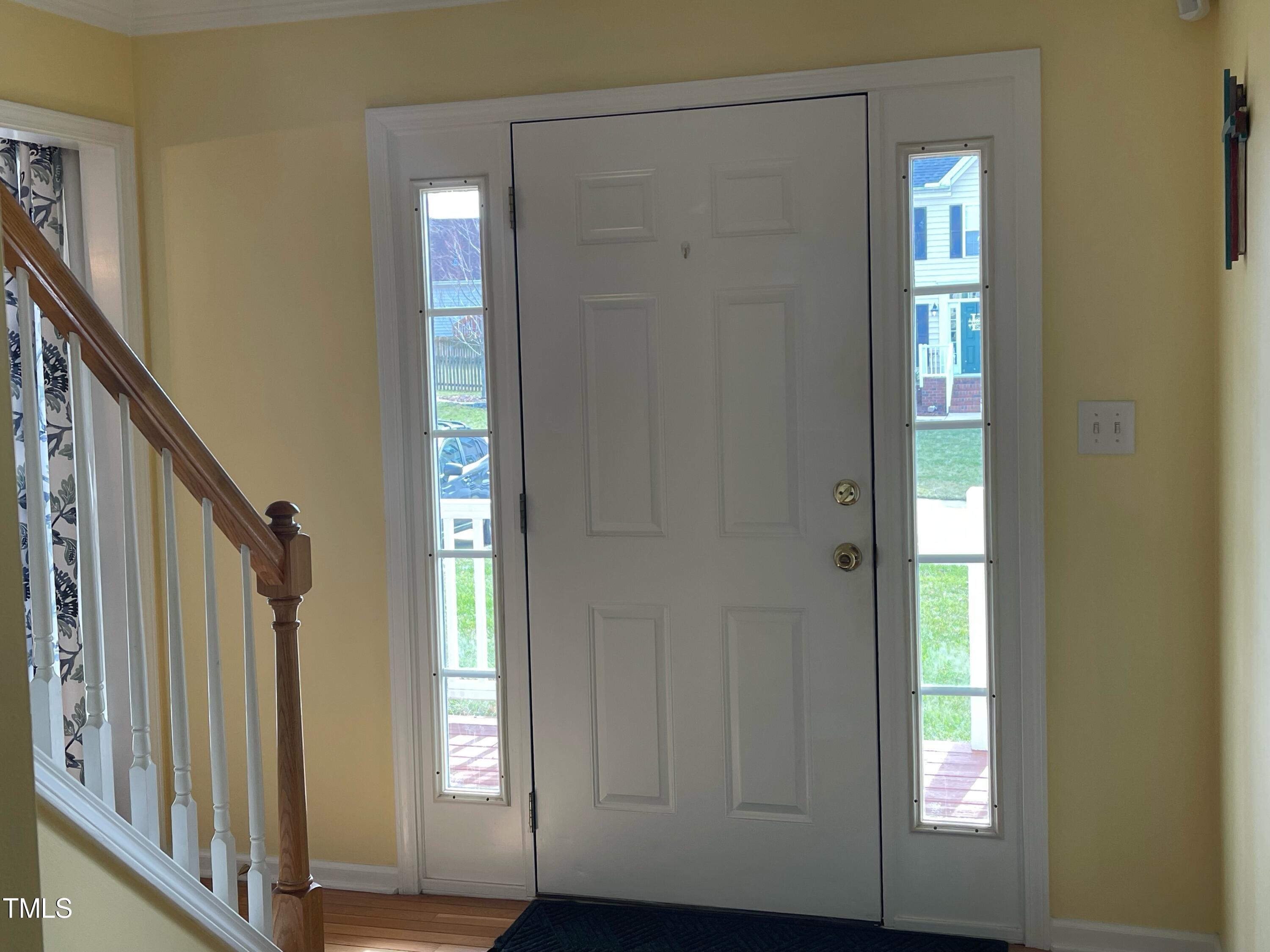 112 Grassy Valley Road Holly Springs, NC 27540 - Photo 7 of 39 a view of an entryway with wooden floor