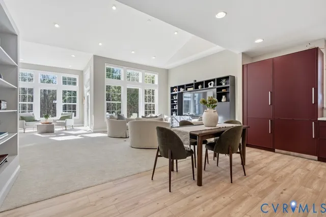 a dining room with furniture and wooden floor