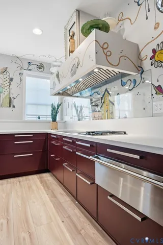 an empty room with a sink and cabinets