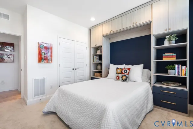 a bedroom with a bed and a walk in closet