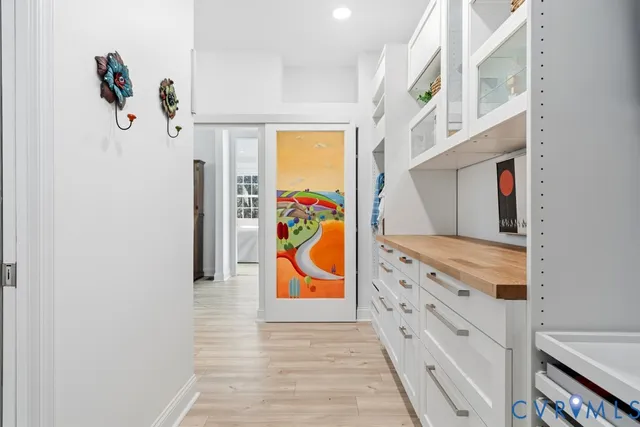 a view of an entryway with wooden floor