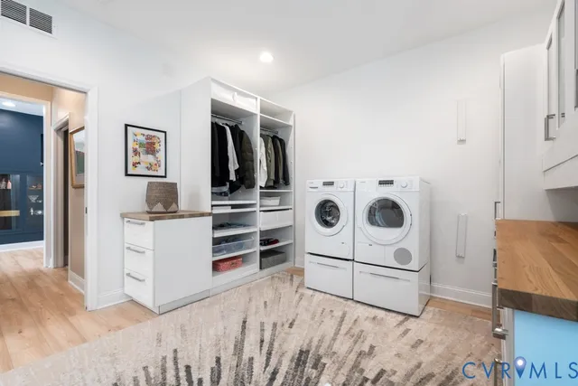 a kitchen with a stove and white cabinets
