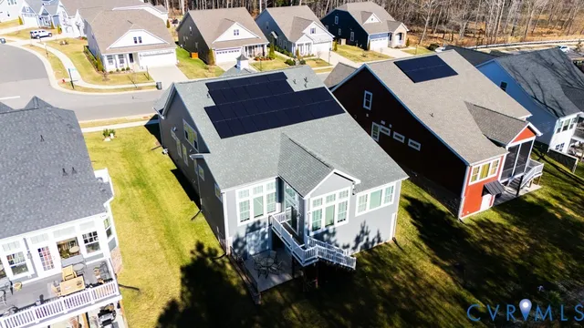 a aerial view of a residential apartment building with a yard
