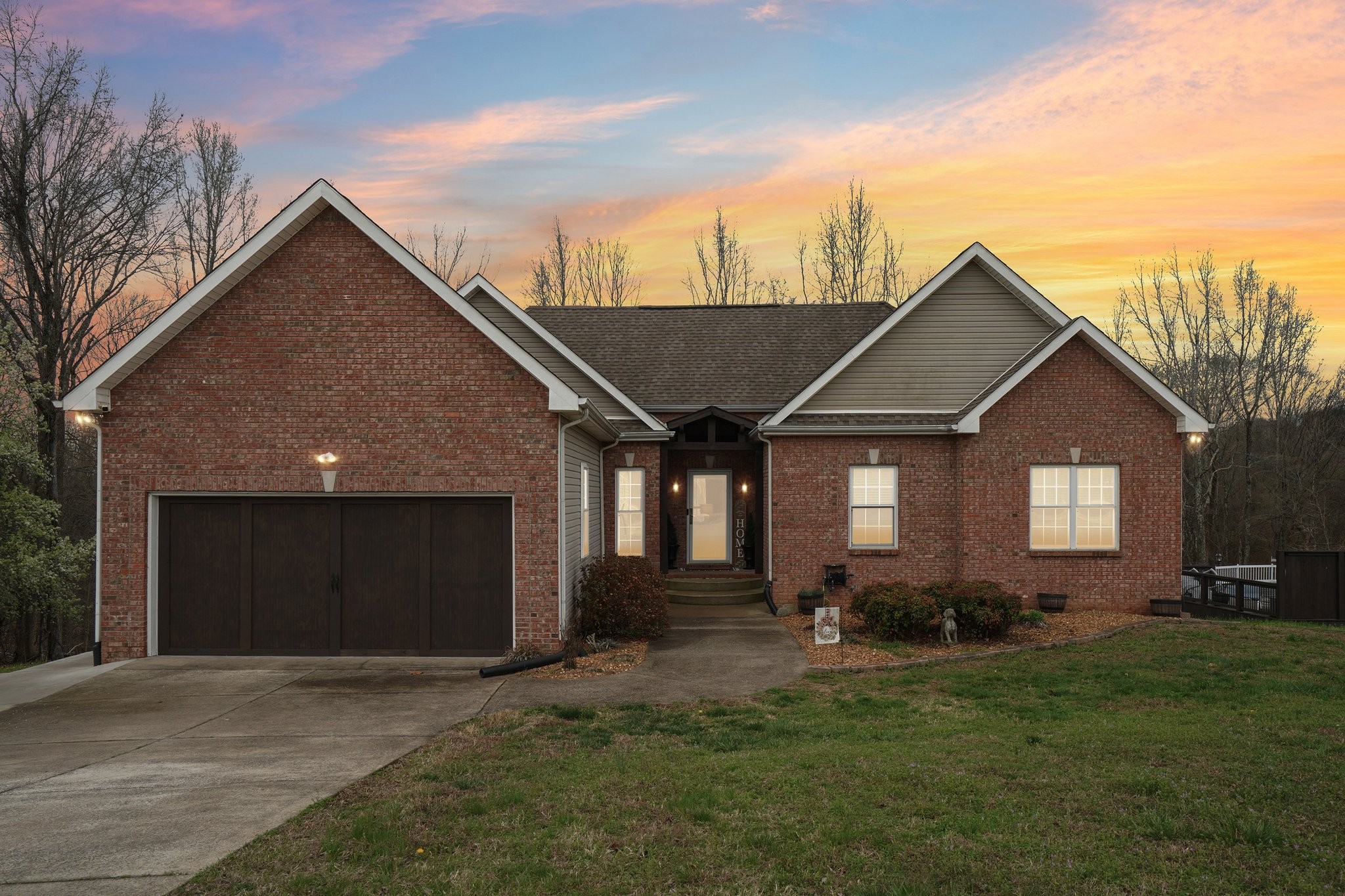 2994 Jarrell Ridge Farms Clarksville, TN 37043 - Photo 2 of 37 a front view of house with yard and trees in the background