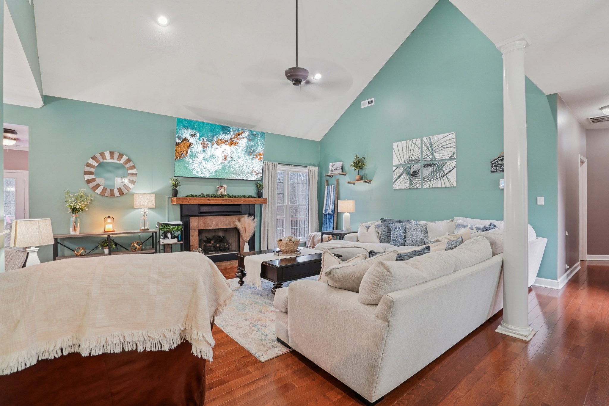 2994 Jarrell Ridge Farms Clarksville, TN 37043 - Photo 6 of 37 a living room with furniture a fireplace and a chandelier