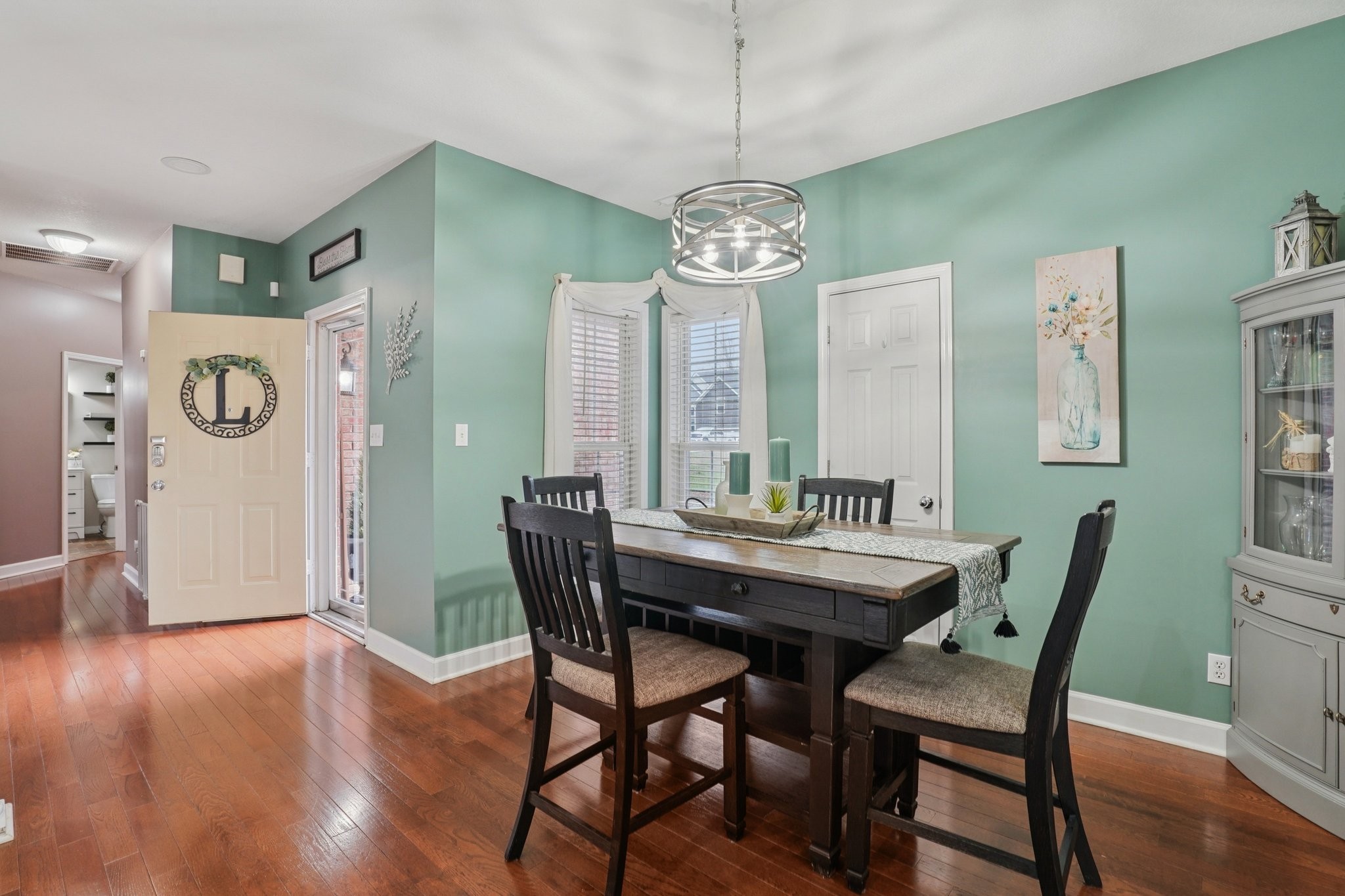 2994 Jarrell Ridge Farms Clarksville, TN 37043 - Photo 9 of 37 a view of a dining room with furniture a chandelier and wooden floor