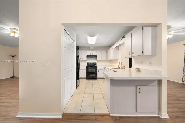 a large bathroom with a sink and a mirror