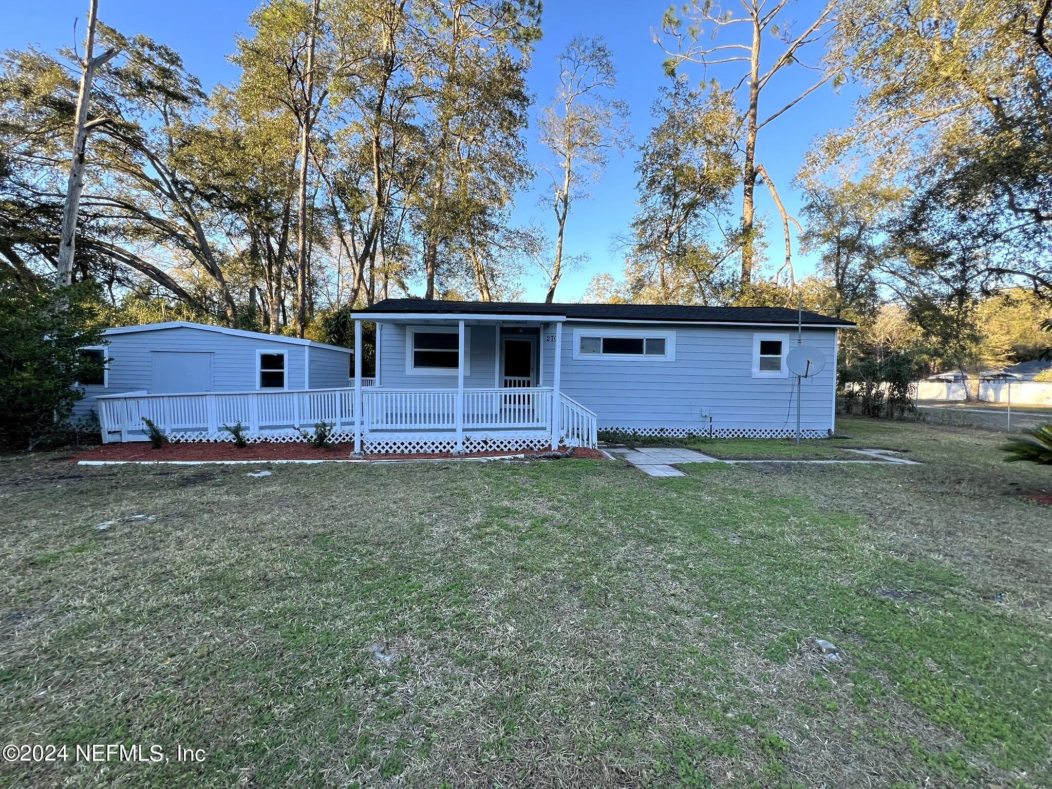 2704 Forman Circle Middleburg, FL 32068 - Photo 1 of 14 a front view of a house with garden