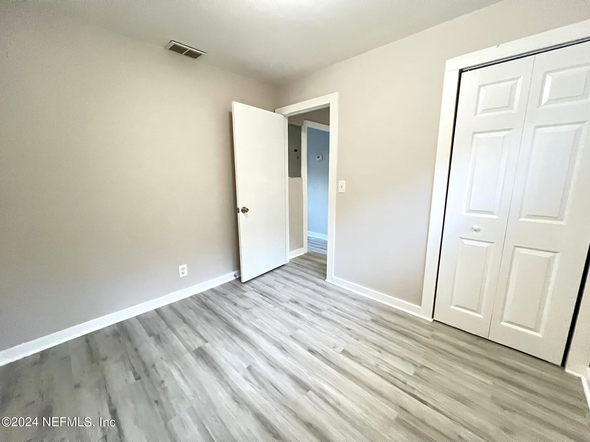 2704 Forman Circle Middleburg, FL 32068 - Photo 12 of 14 a view of an empty room with wooden floor