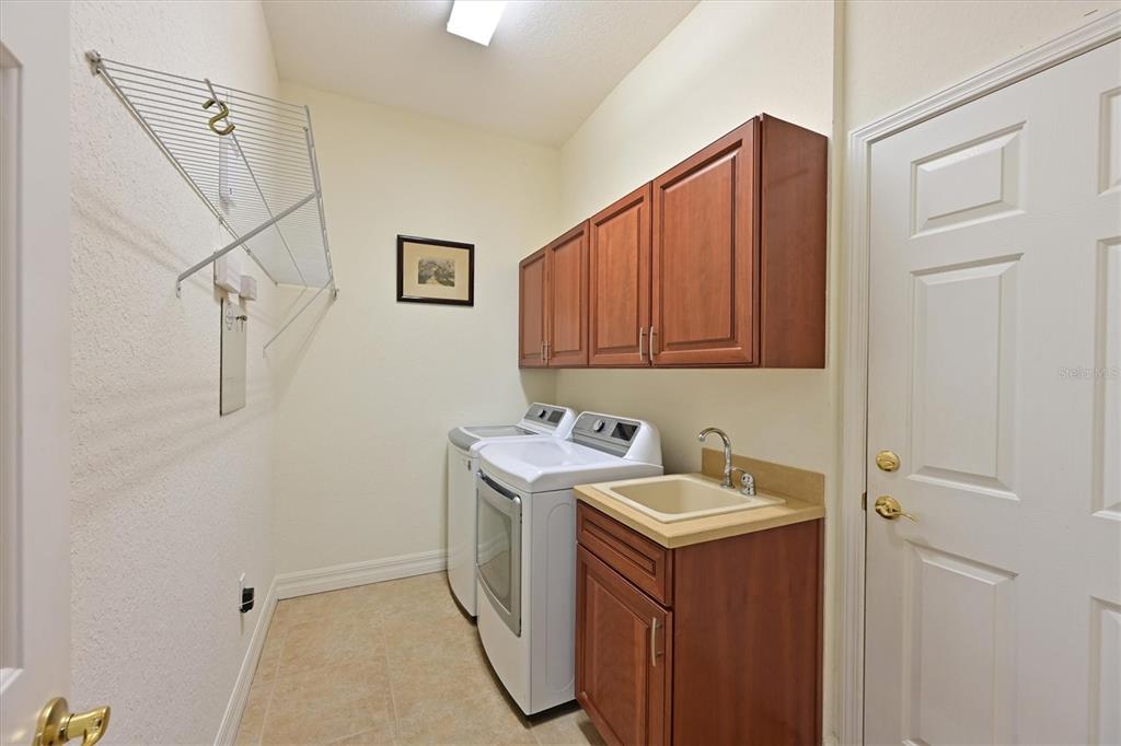 10622 Conch Shell Terrace Bradenton, FL 34212 - Photo 45 of 69 a utility room with dryer and washer