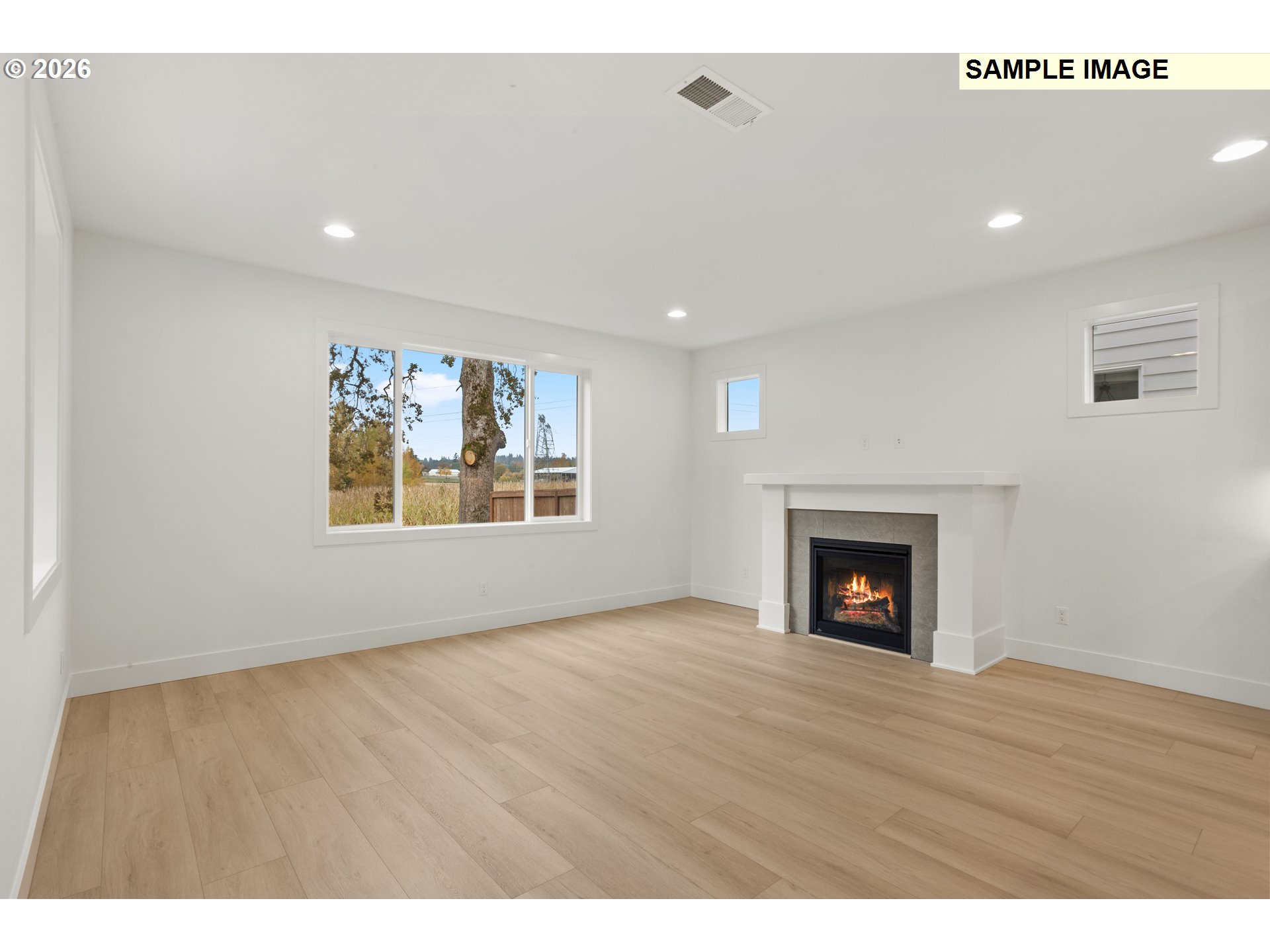 7283 Southwest Frog Pond Lane Wilsonville, OR 97070 - Photo 17 of 33 a view of an empty room and a fireplace