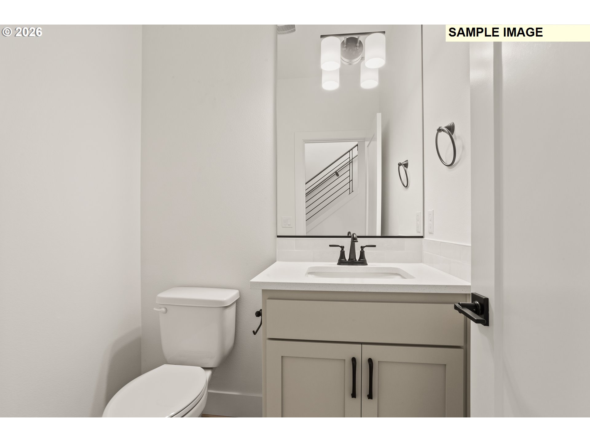 7283 Southwest Frog Pond Lane Wilsonville, OR 97070 - Photo 18 of 33 a bathroom with a sink toilet and mirror