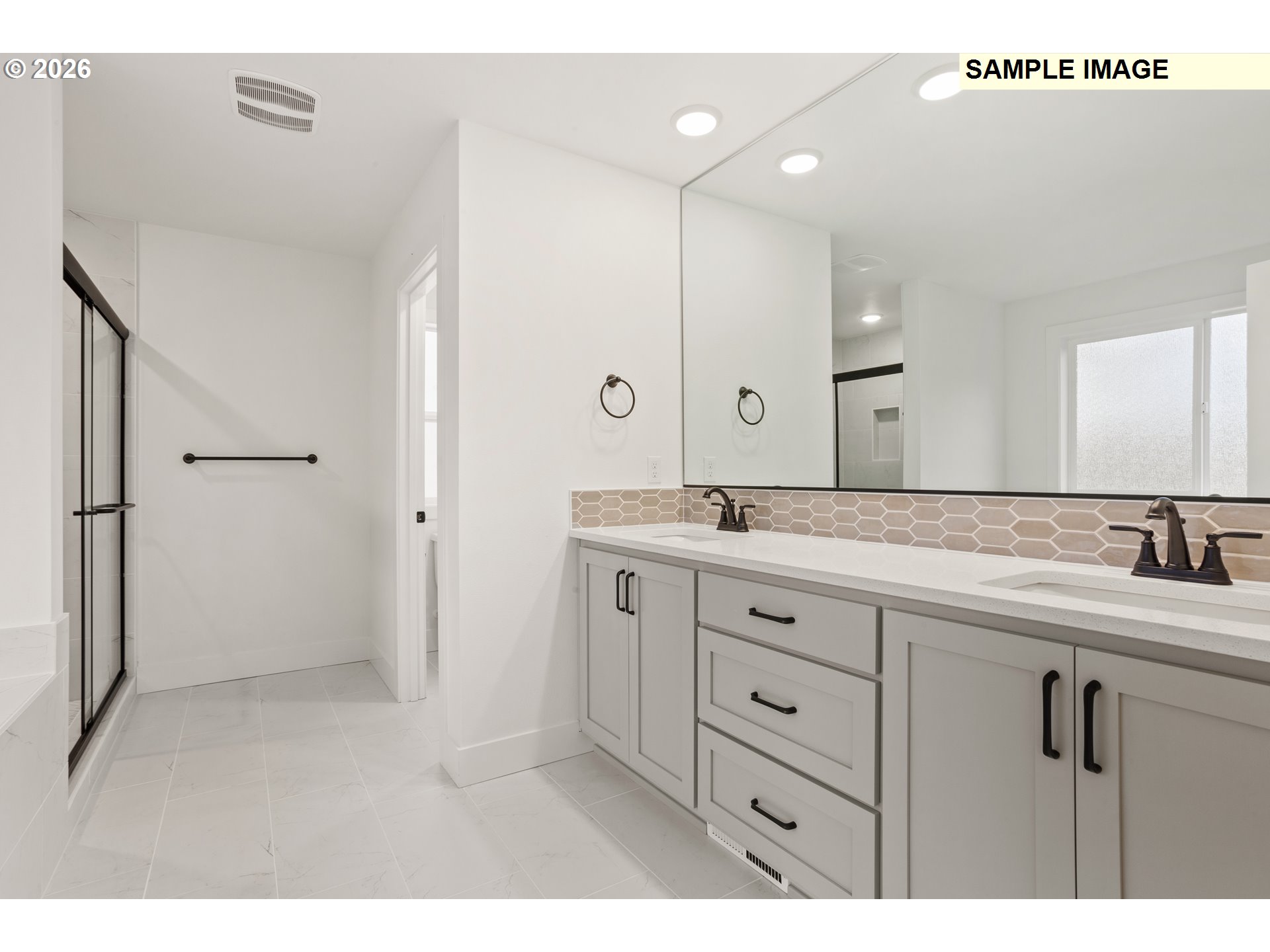 7283 Southwest Frog Pond Lane Wilsonville, OR 97070 - Photo 25 of 33 a bathroom with a granite countertop sink two mirror and shower