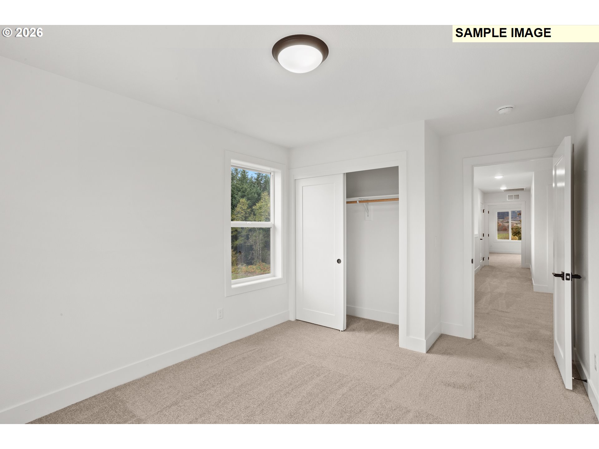 7283 Southwest Frog Pond Lane Wilsonville, OR 97070 - Photo 29 of 33 a view of an empty room with wooden floor and a window