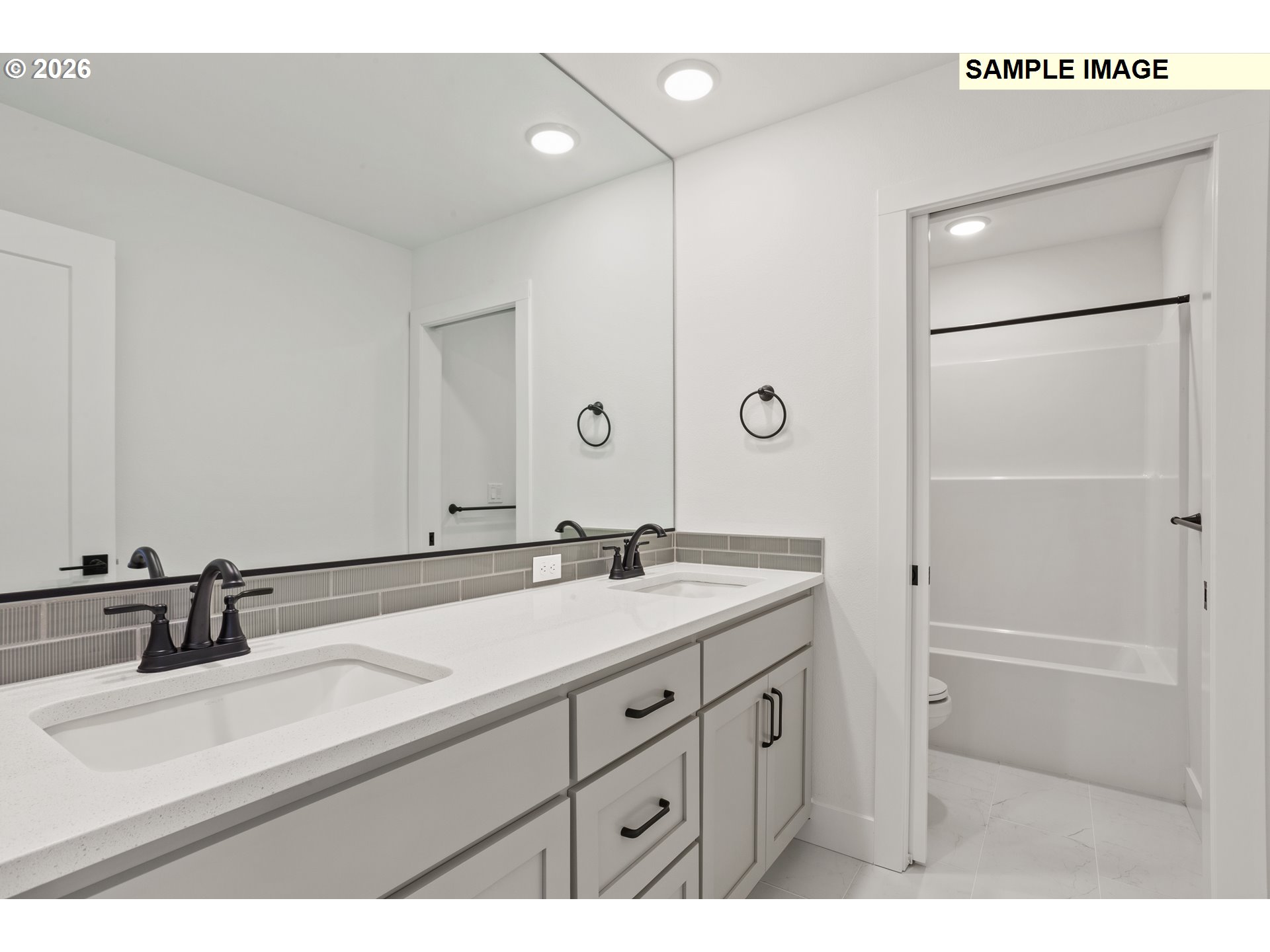 7283 Southwest Frog Pond Lane Wilsonville, OR 97070 - Photo 32 of 33 a bathroom with a sink and a mirror
