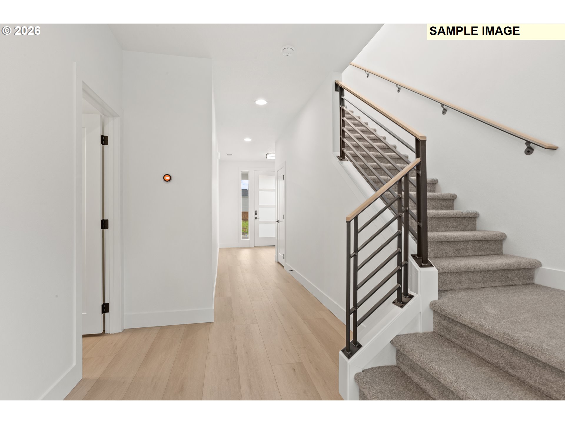 7283 Southwest Frog Pond Lane Wilsonville, OR 97070 - Photo 5 of 33 a view interior of a house with wooden floor and stairs