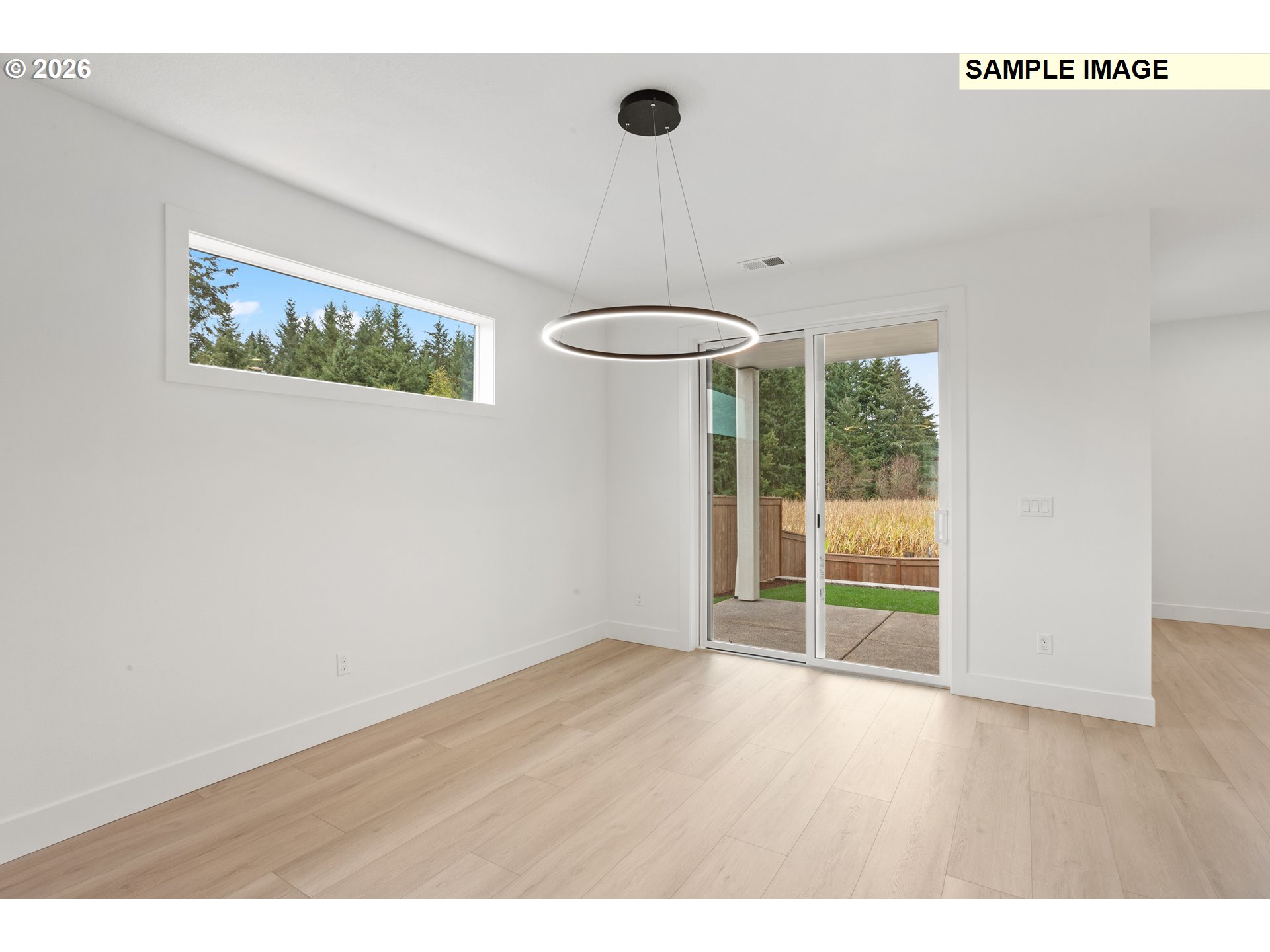 7283 Southwest Frog Pond Lane Wilsonville, OR 97070 - Photo 6 of 33 a view of an empty room with a window