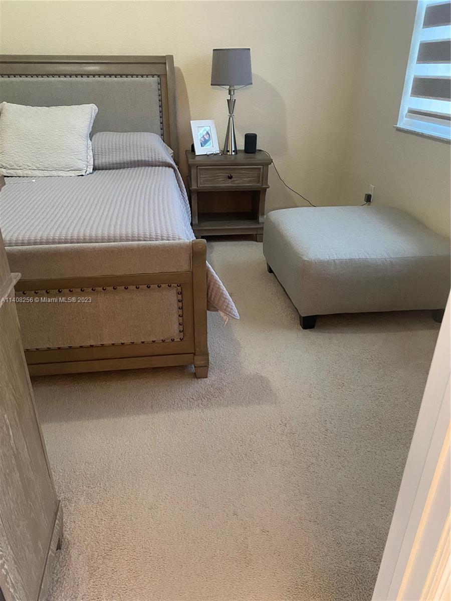 12812 Southwest 134th Terrace Miami, FL 33186 - Photo 15 of 41 a bedroom with a bed and window