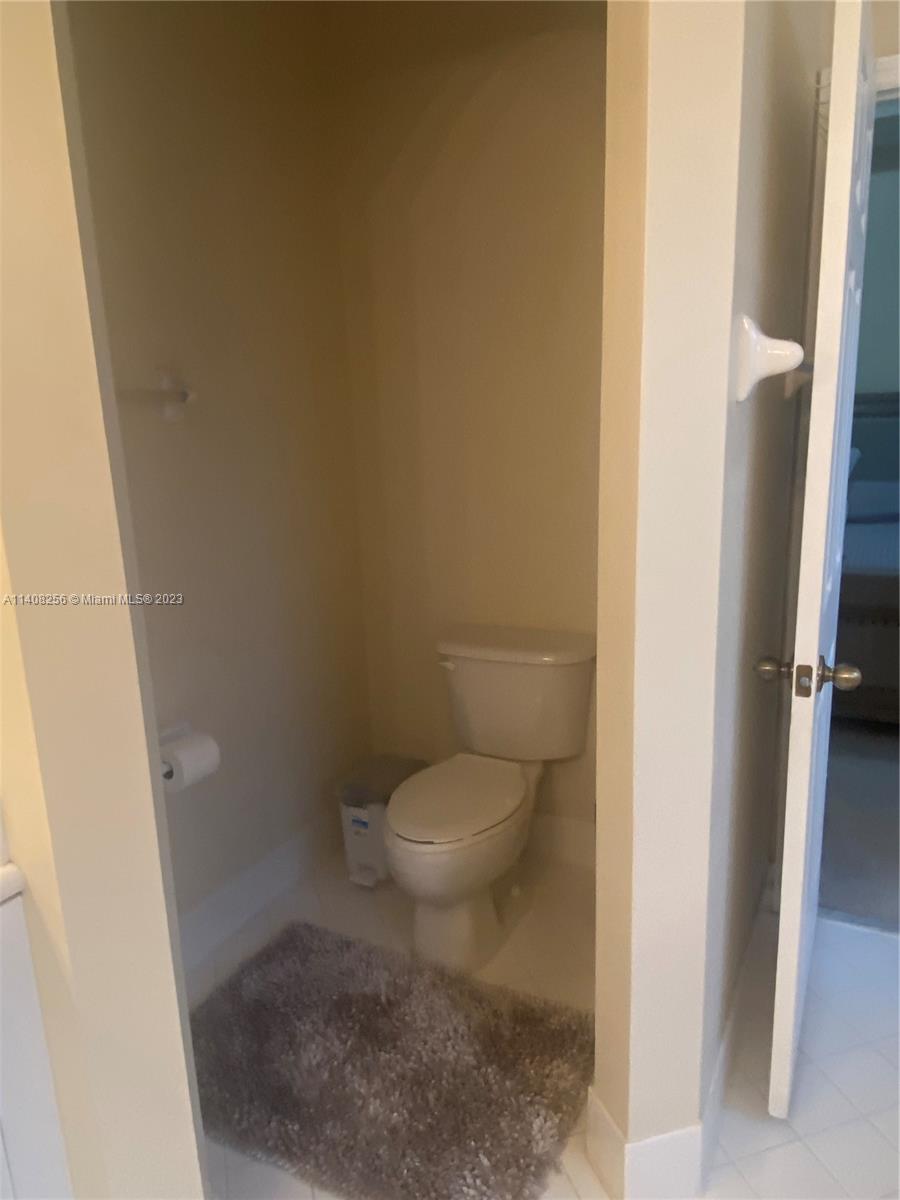 12812 Southwest 134th Terrace Miami, FL 33186 - Photo 19 of 41 a white toilet sitting next to a shower