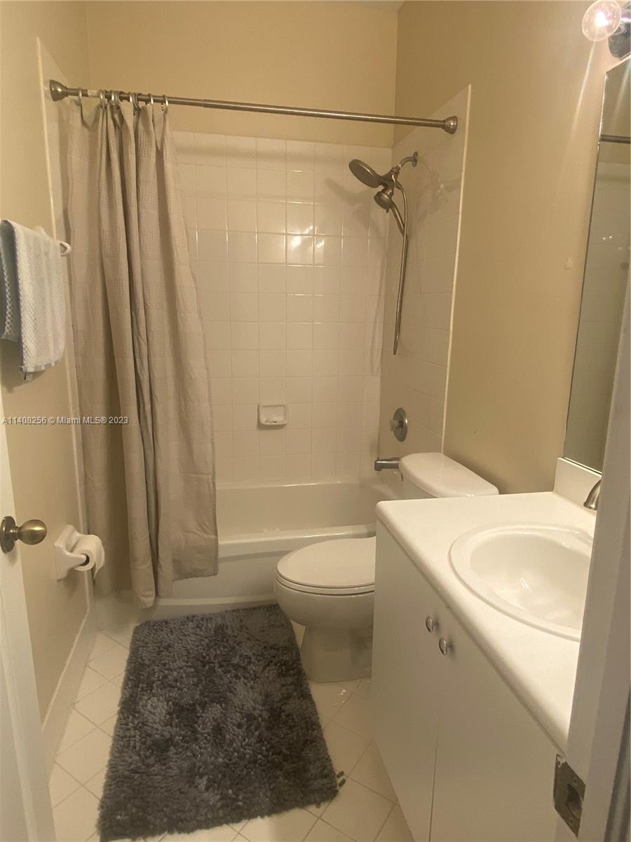 12812 Southwest 134th Terrace Miami, FL 33186 - Photo 23 of 41 a bathroom with a granite countertop sink toilet and shower