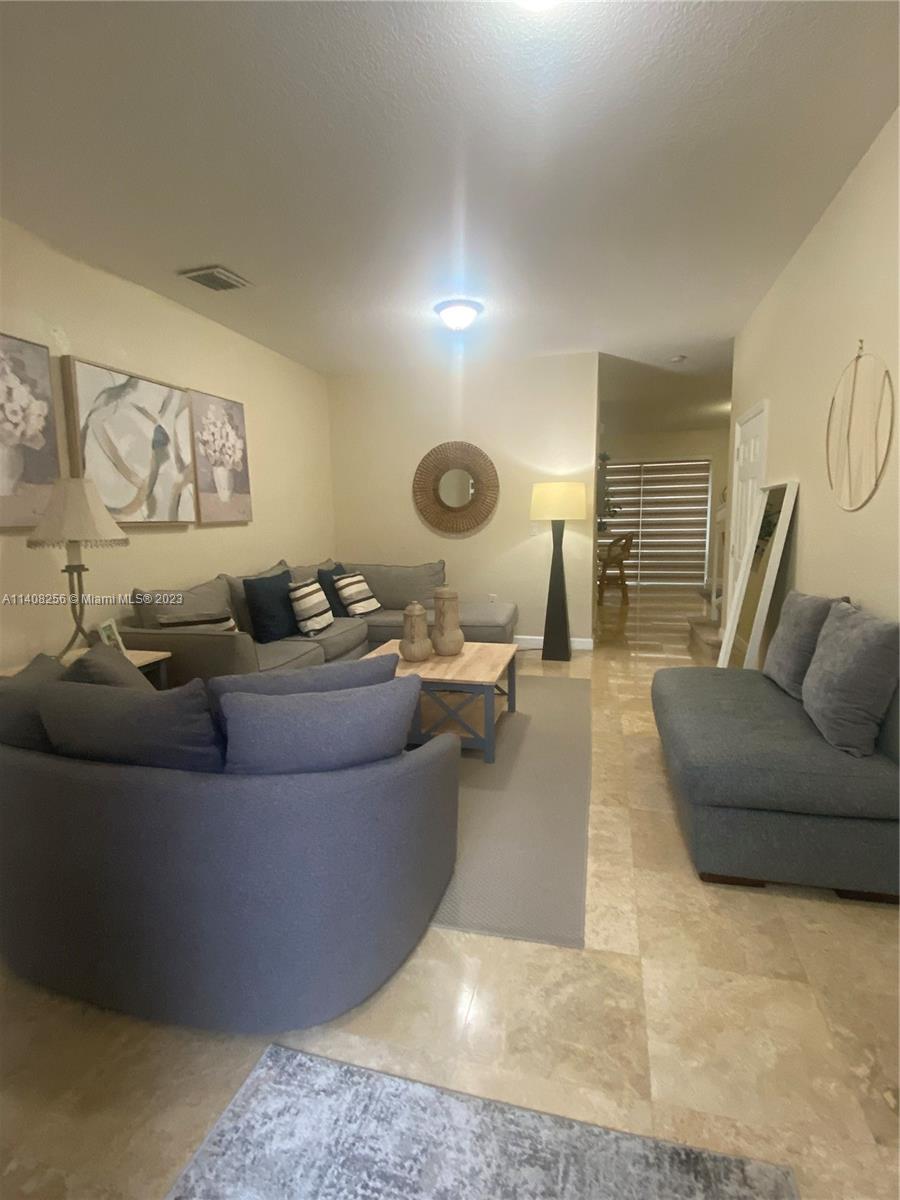 12812 Southwest 134th Terrace Miami, FL 33186 - Photo 4 of 41 a living room with furniture and wooden floor