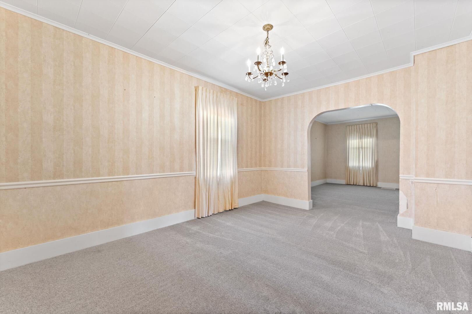 2442 Mittman Road Muscatine, IA 52761 - Photo 11 of 24 a view of an empty room with a window