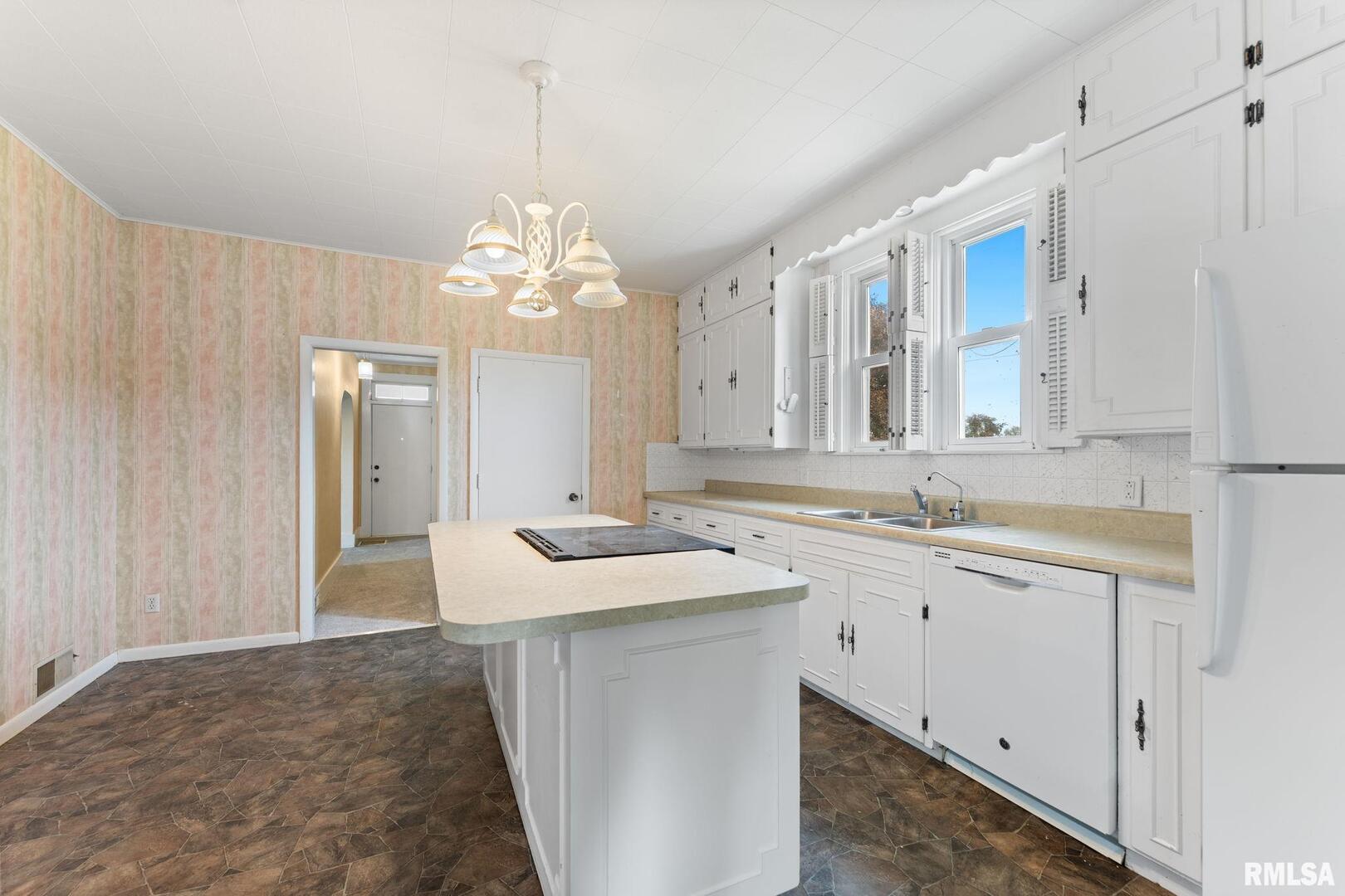2442 Mittman Road Muscatine, IA 52761 - Photo 14 of 24 a bathroom with a sink and a mirror