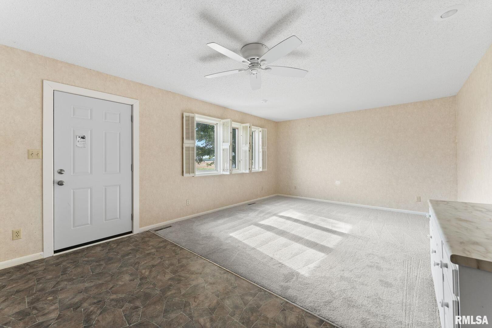 2442 Mittman Road Muscatine, IA 52761 - Photo 15 of 24 a view of an empty room with a window