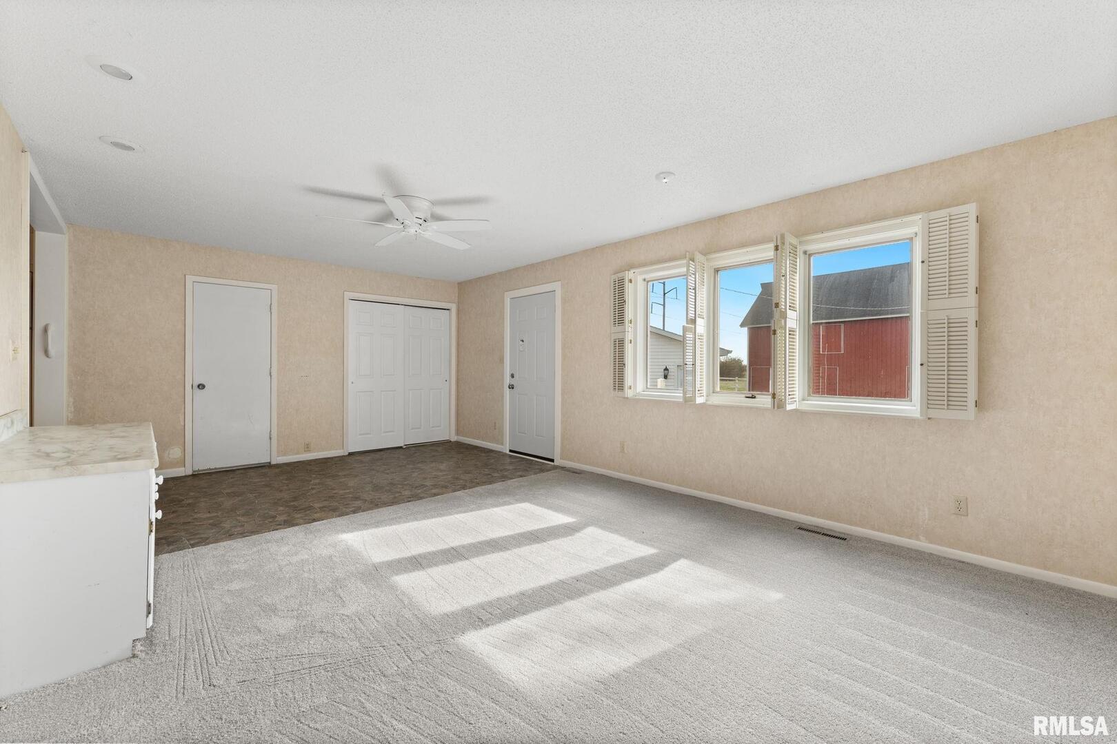 2442 Mittman Road Muscatine, IA 52761 - Photo 16 of 24 a view of an empty room with a window