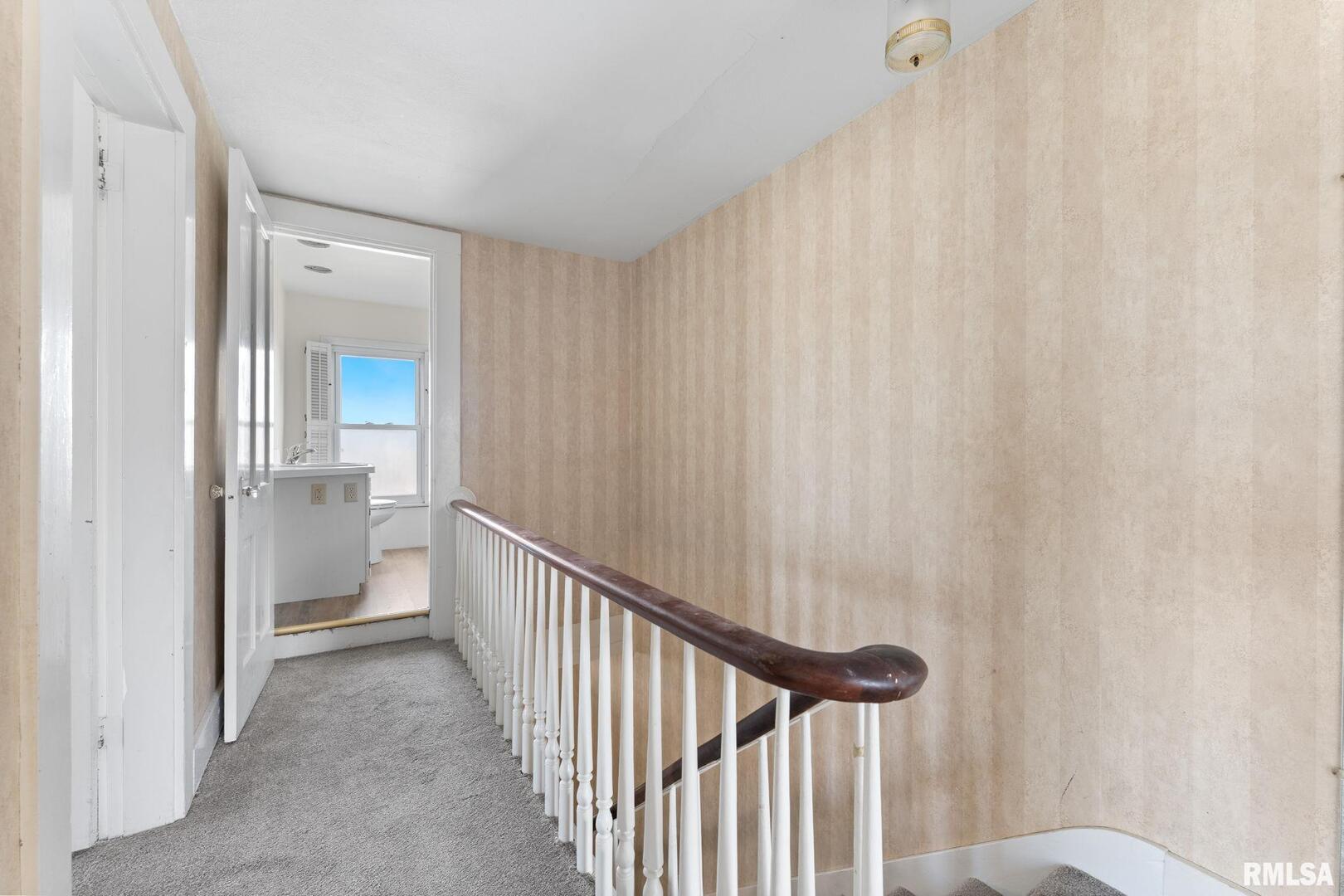 2442 Mittman Road Muscatine, IA 52761 - Photo 21 of 24 a view of a hallway with a white walls