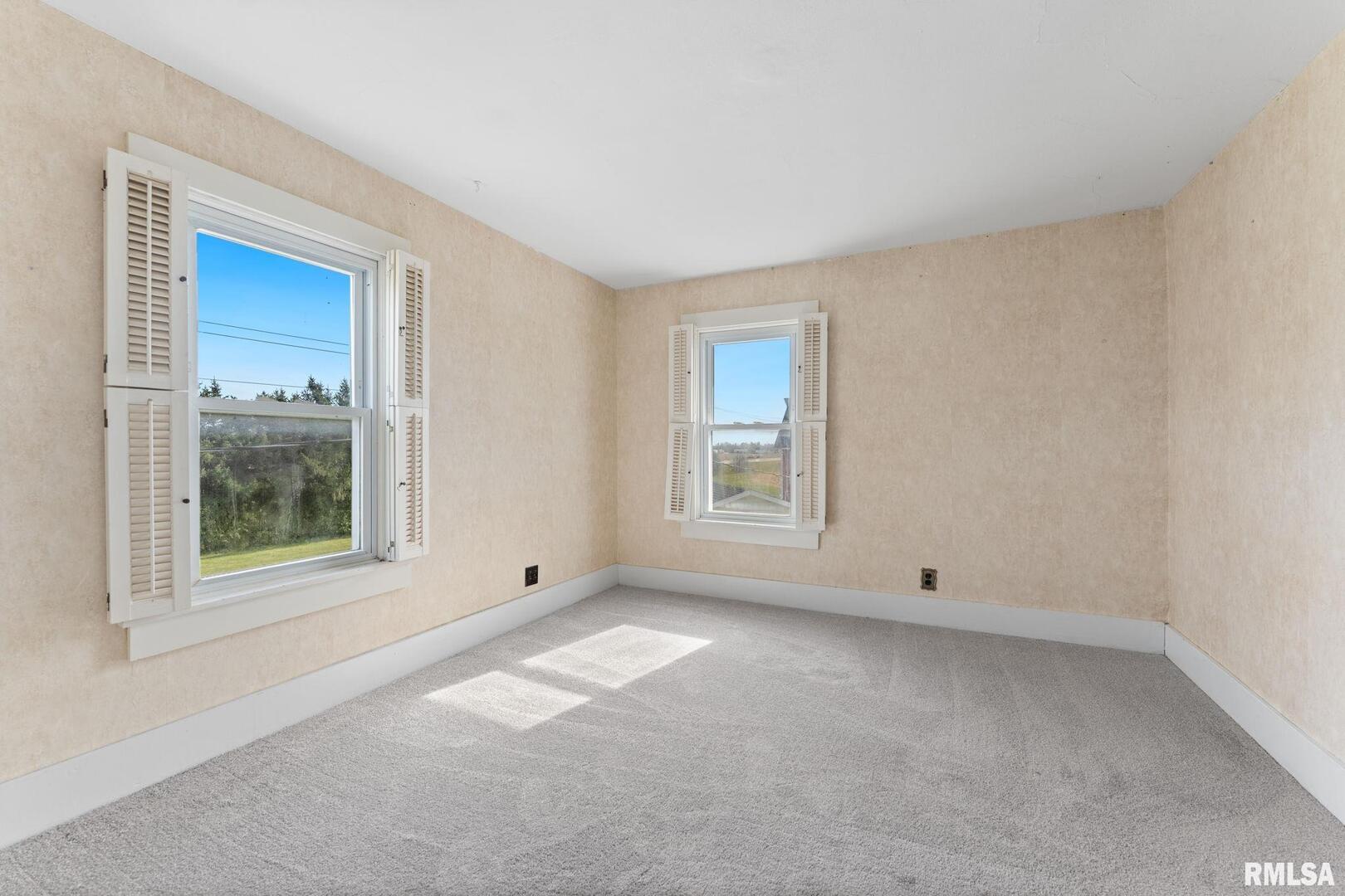2442 Mittman Road Muscatine, IA 52761 - Photo 22 of 24 a view of an empty room with a window