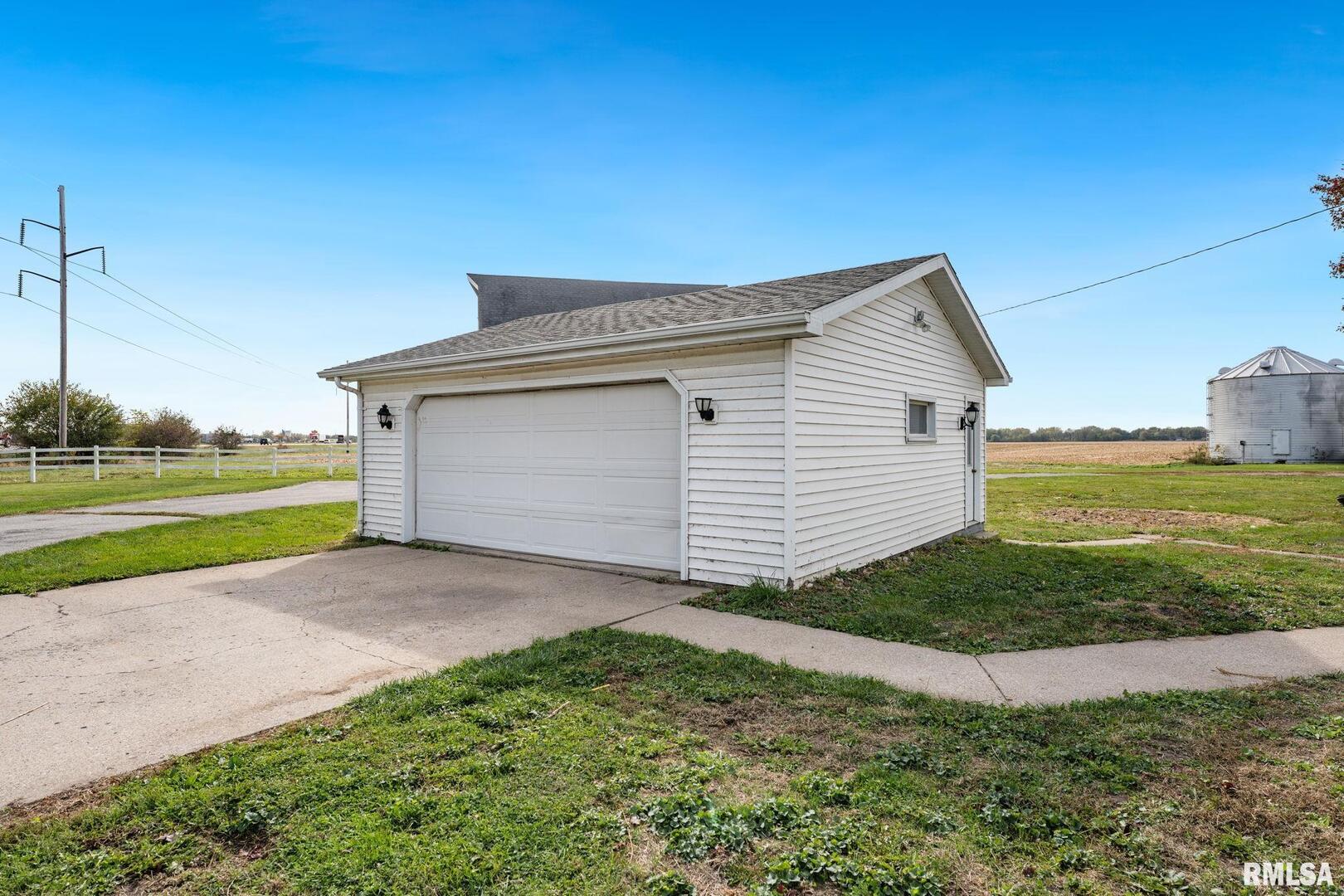 2442 Mittman Road Muscatine, IA 52761 - Photo 3 of 24 a view of a house with a yard