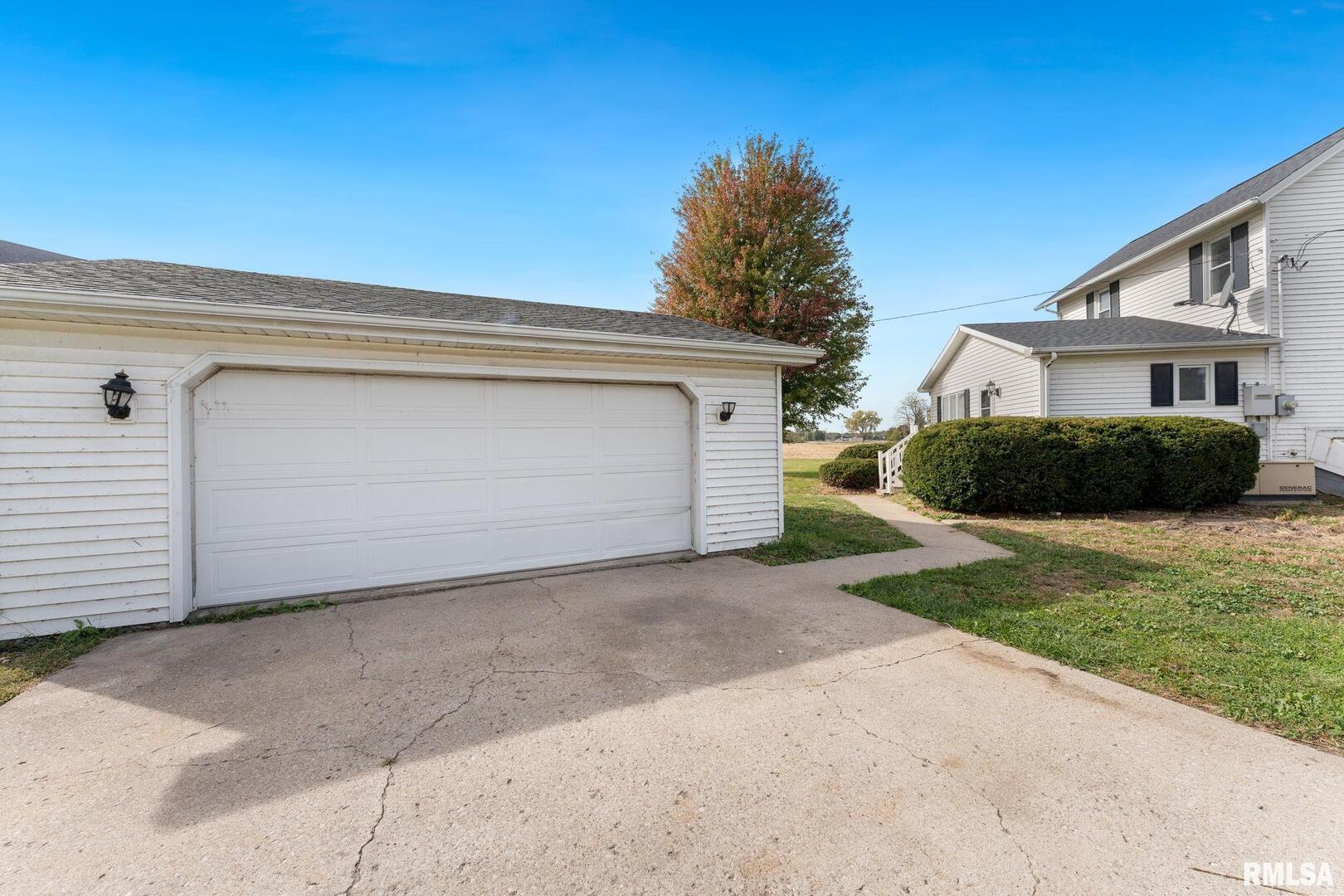 2442 Mittman Road Muscatine, IA 52761 - Photo 4 of 24 a view of a house with a yard