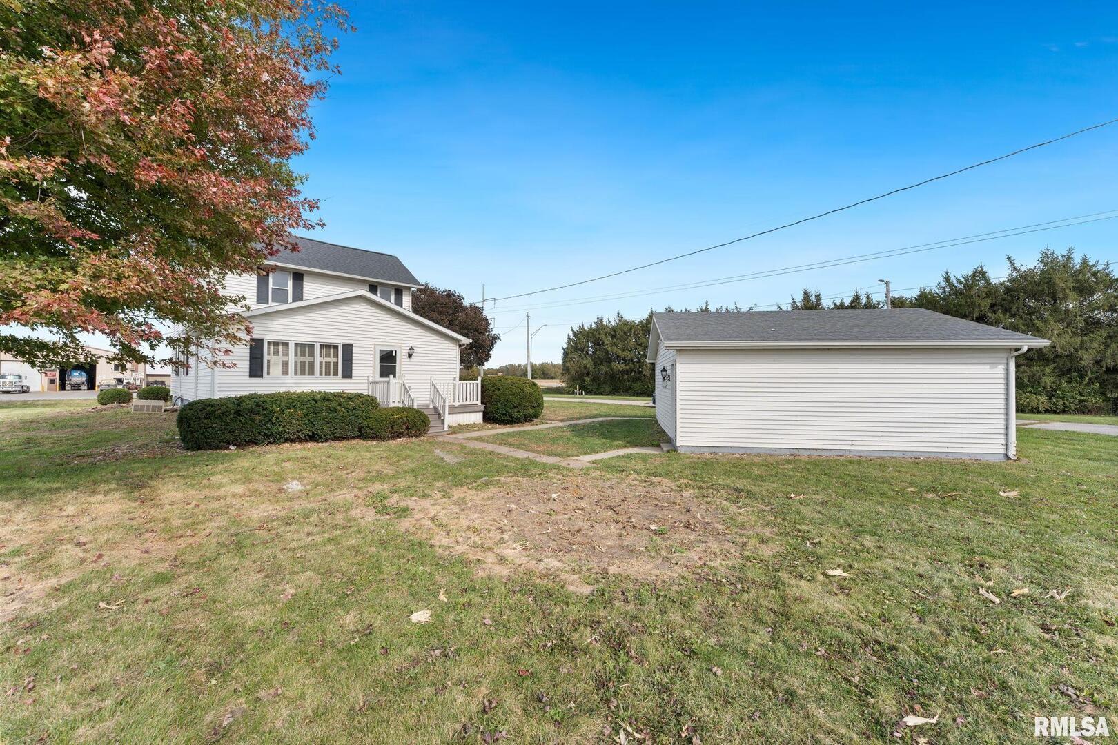 2442 Mittman Road Muscatine, IA 52761 - Photo 5 of 24 a view of a house with a yard