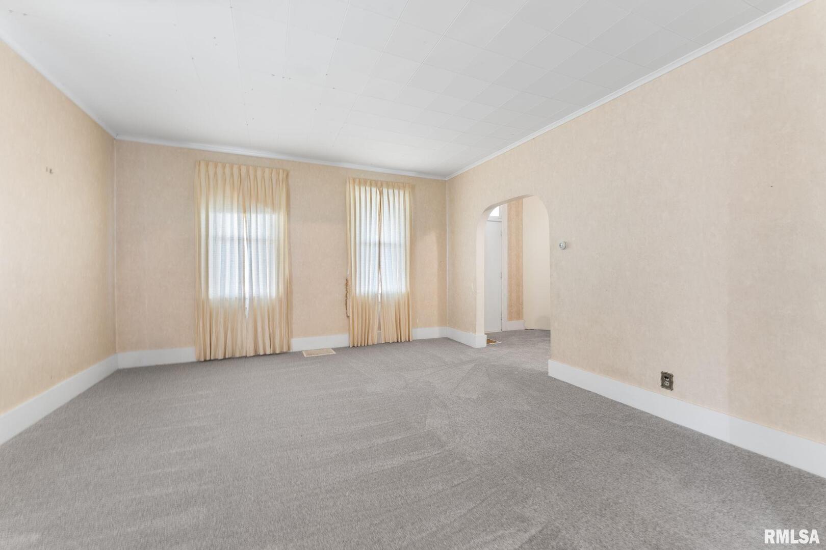 2442 Mittman Road Muscatine, IA 52761 - Photo 9 of 24 an empty room with windows and closet