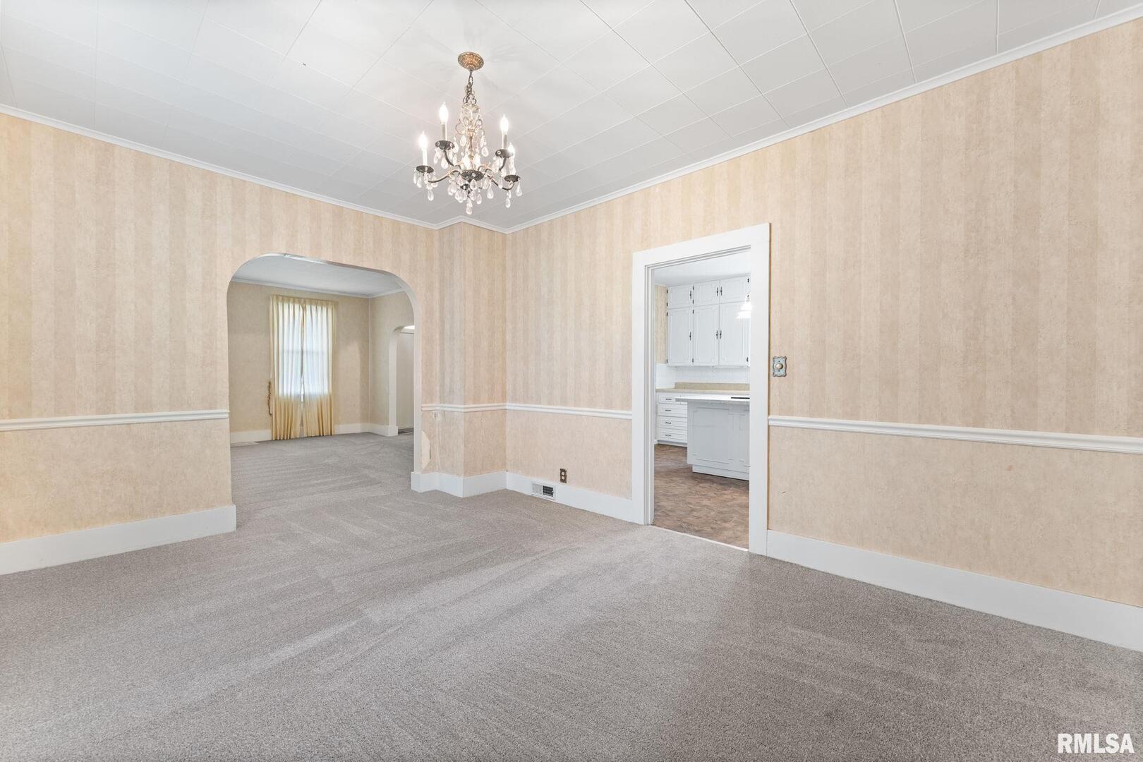 2442 Mittman Road Muscatine, IA 52761 - Photo 10 of 24 a view of an empty room with a window