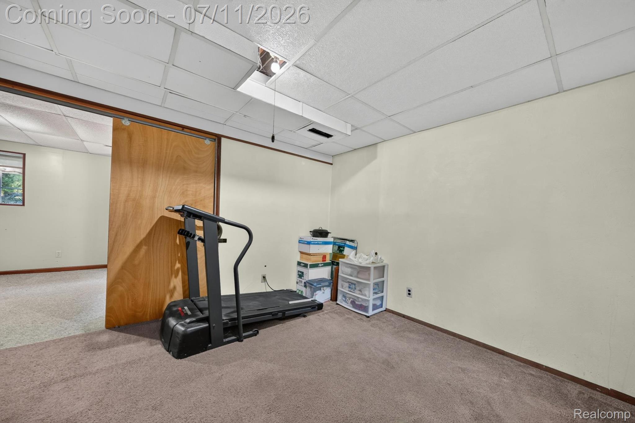 4430 North Center Road Flint, MI 48506 - Photo 32 of 49 Carpeted room with a drop ceiling and light-toned walls