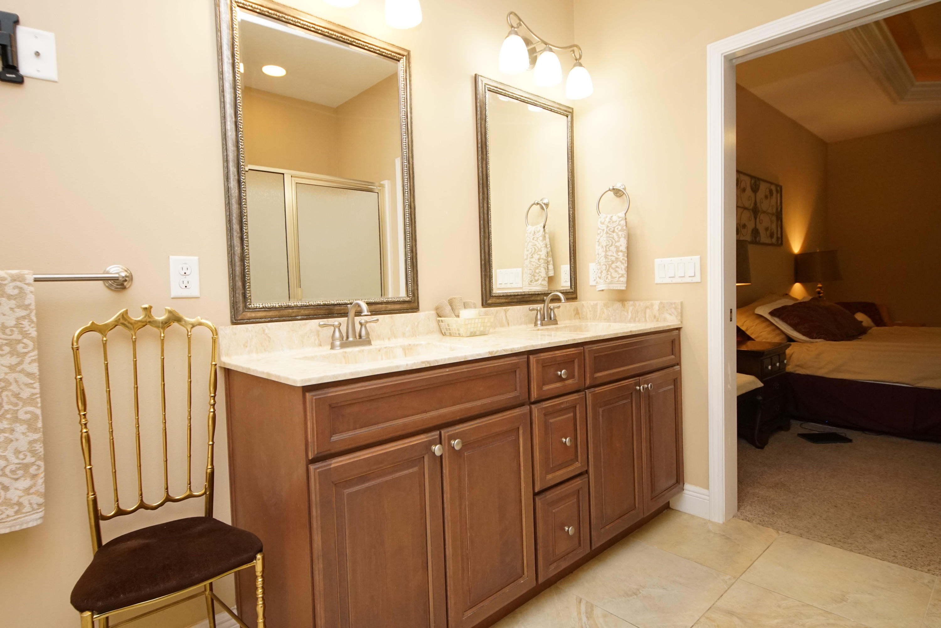 616 Lang Road Fort Walton Beach, FL 32547 - Photo 27 of 54 a spacious bathroom with a double vanity sink a mirror and a