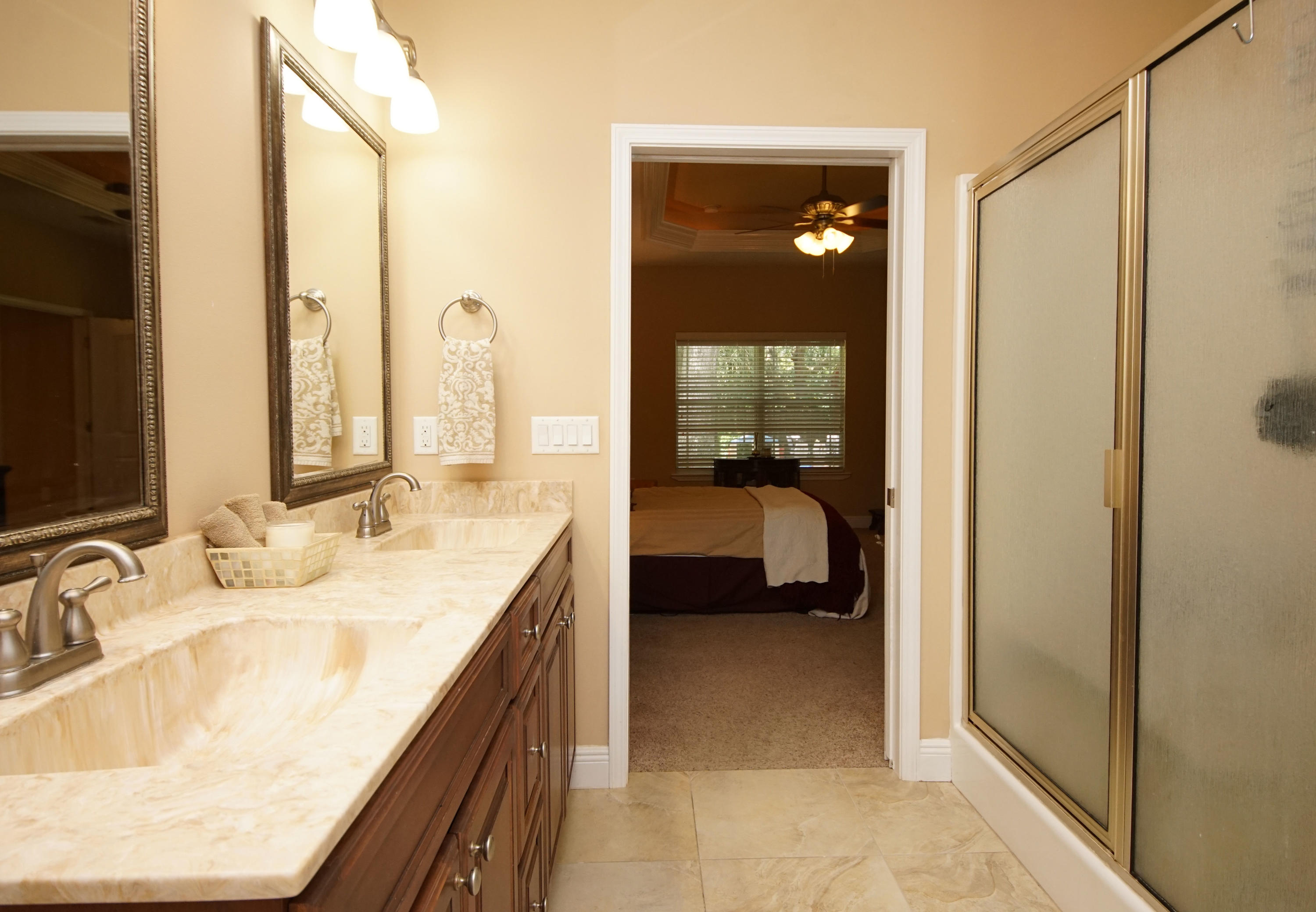 616 Lang Road Fort Walton Beach, FL 32547 - Photo 28 of 54 a en suite bathroom with a granite countertop sink and a mirror